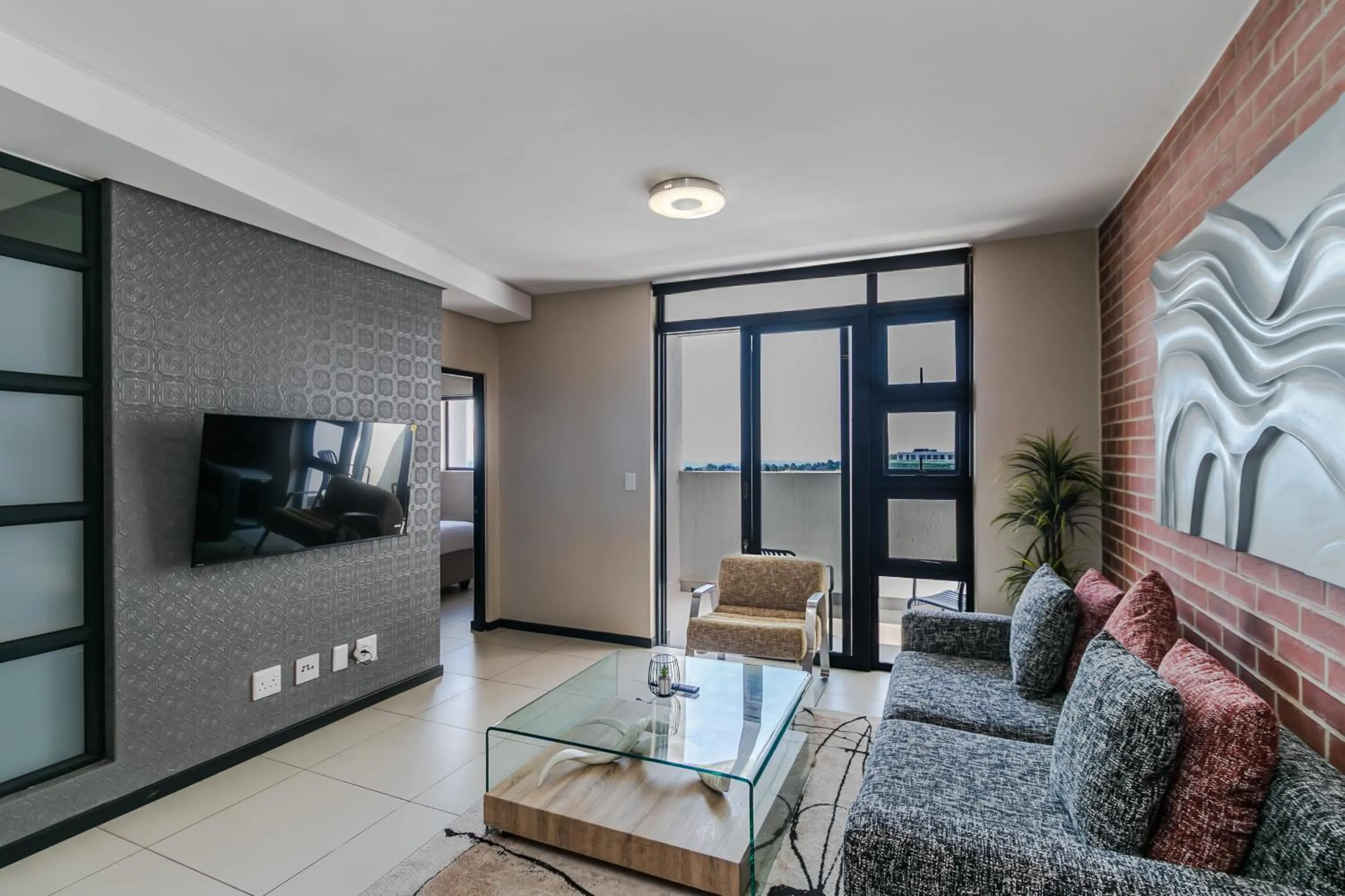 Communal lounge/ TV room in Easy Stay - The Vantage Rosebank