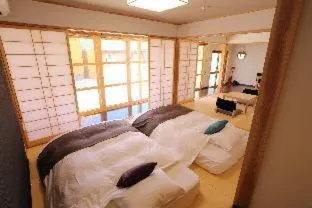 Bed in Tabinoteitaku Okinawa Nakijin HOMANN CONCEPT