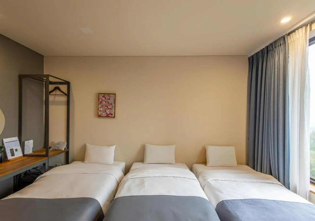 Bed in JK Blossom Hotel