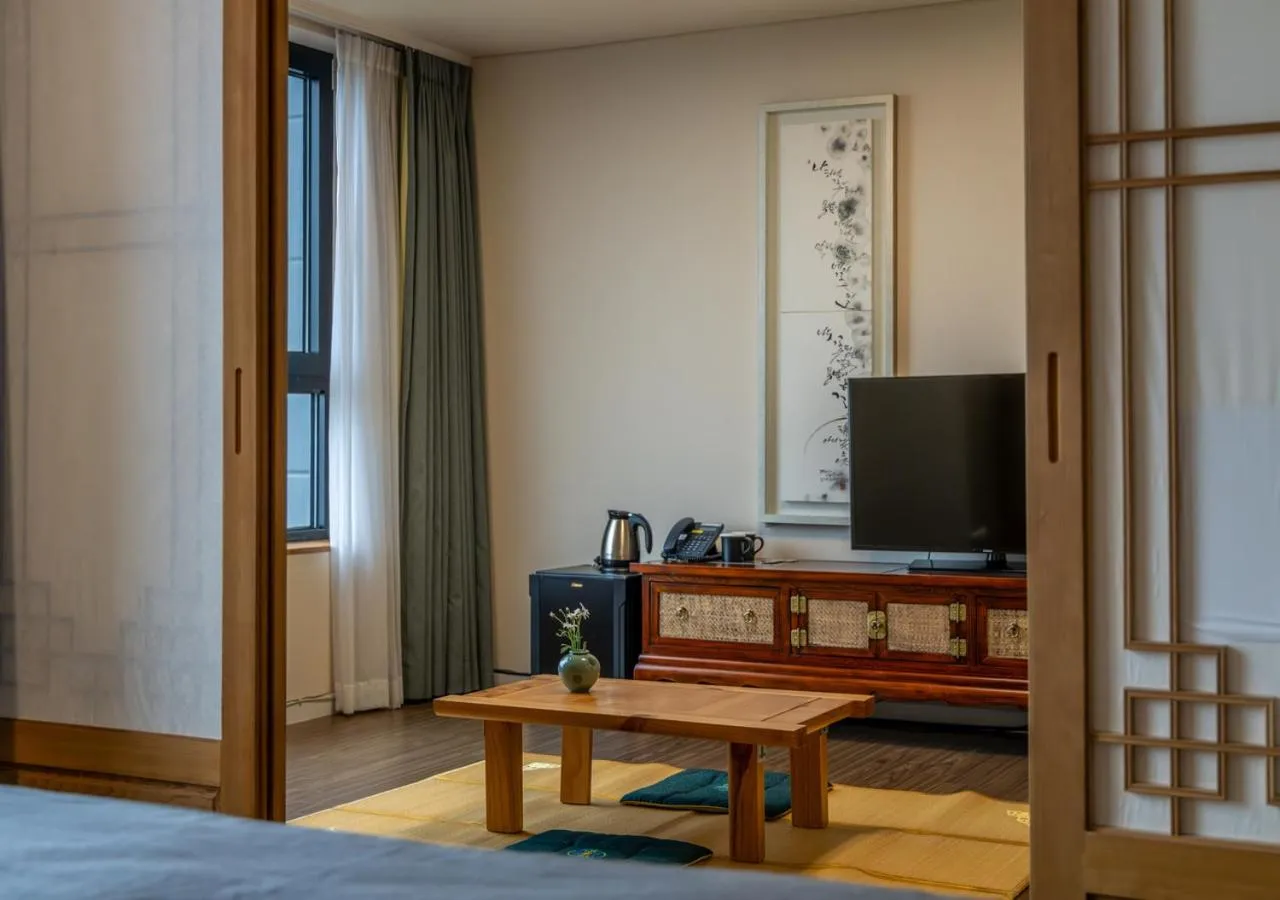 Communal lounge/ TV room in JK Blossom Hotel