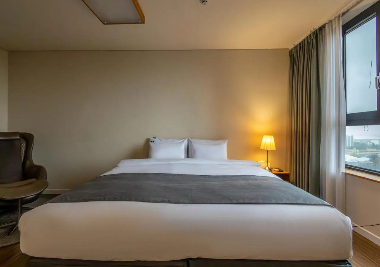 Bed in JK Blossom Hotel