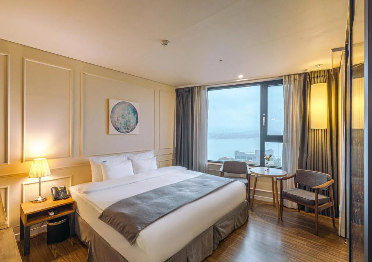 Bed in JK Blossom Hotel