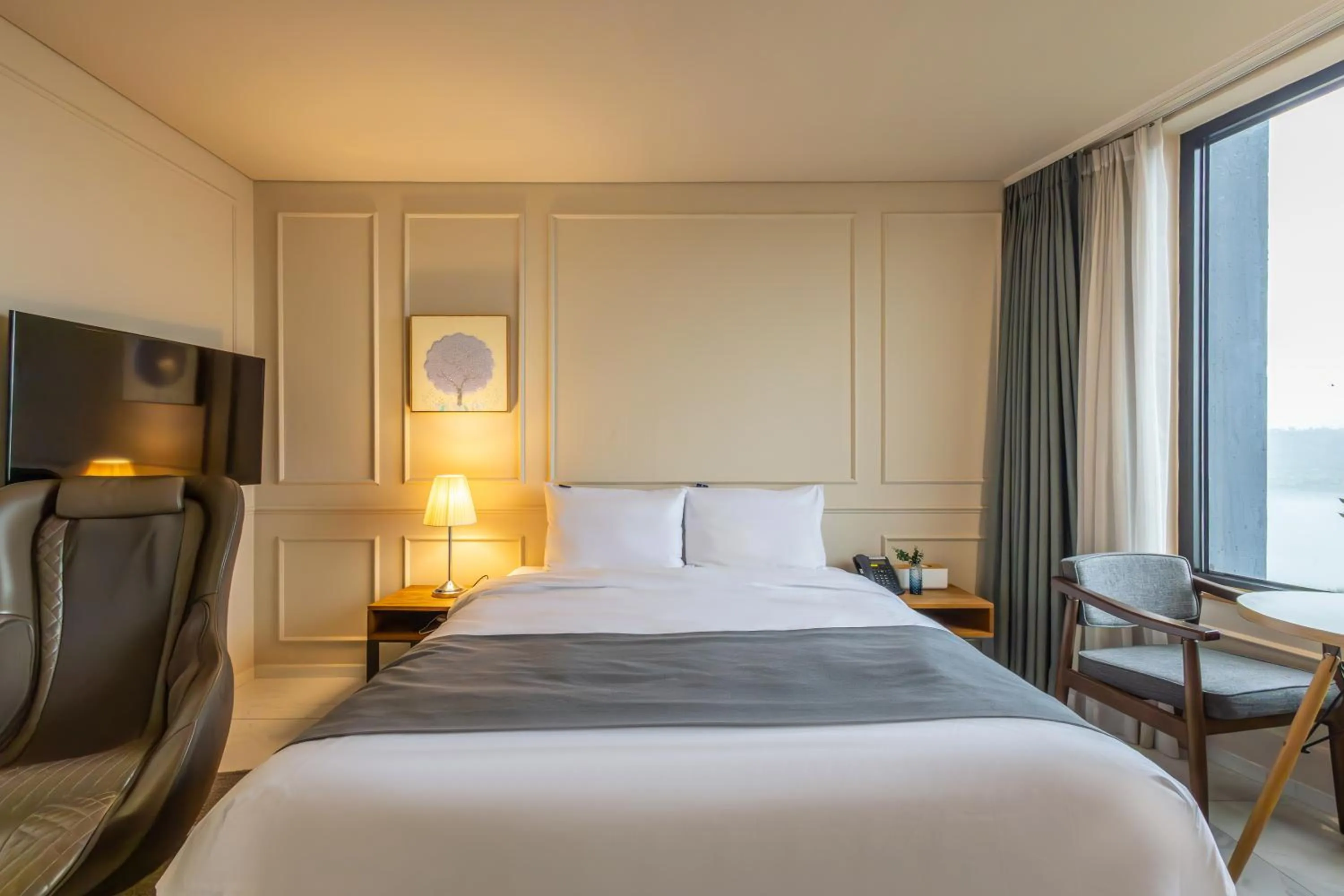 Bed in JK Blossom Hotel