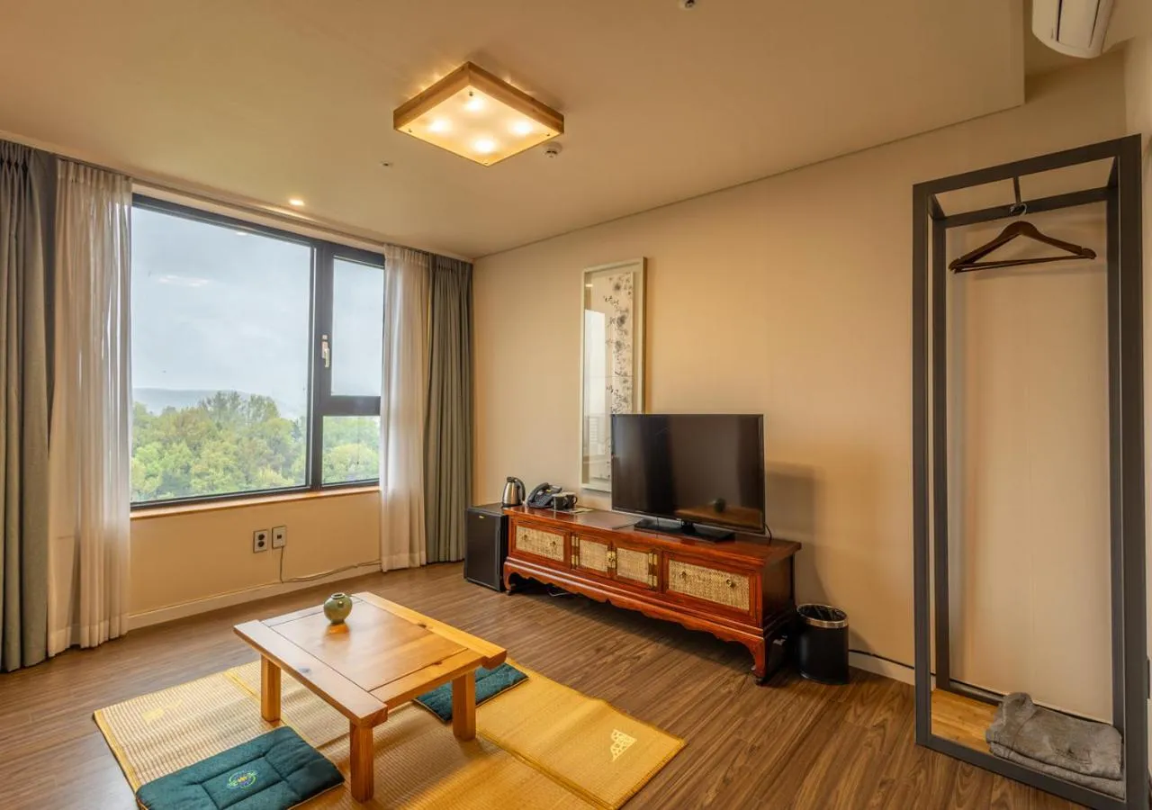 Communal lounge/ TV room in JK Blossom Hotel