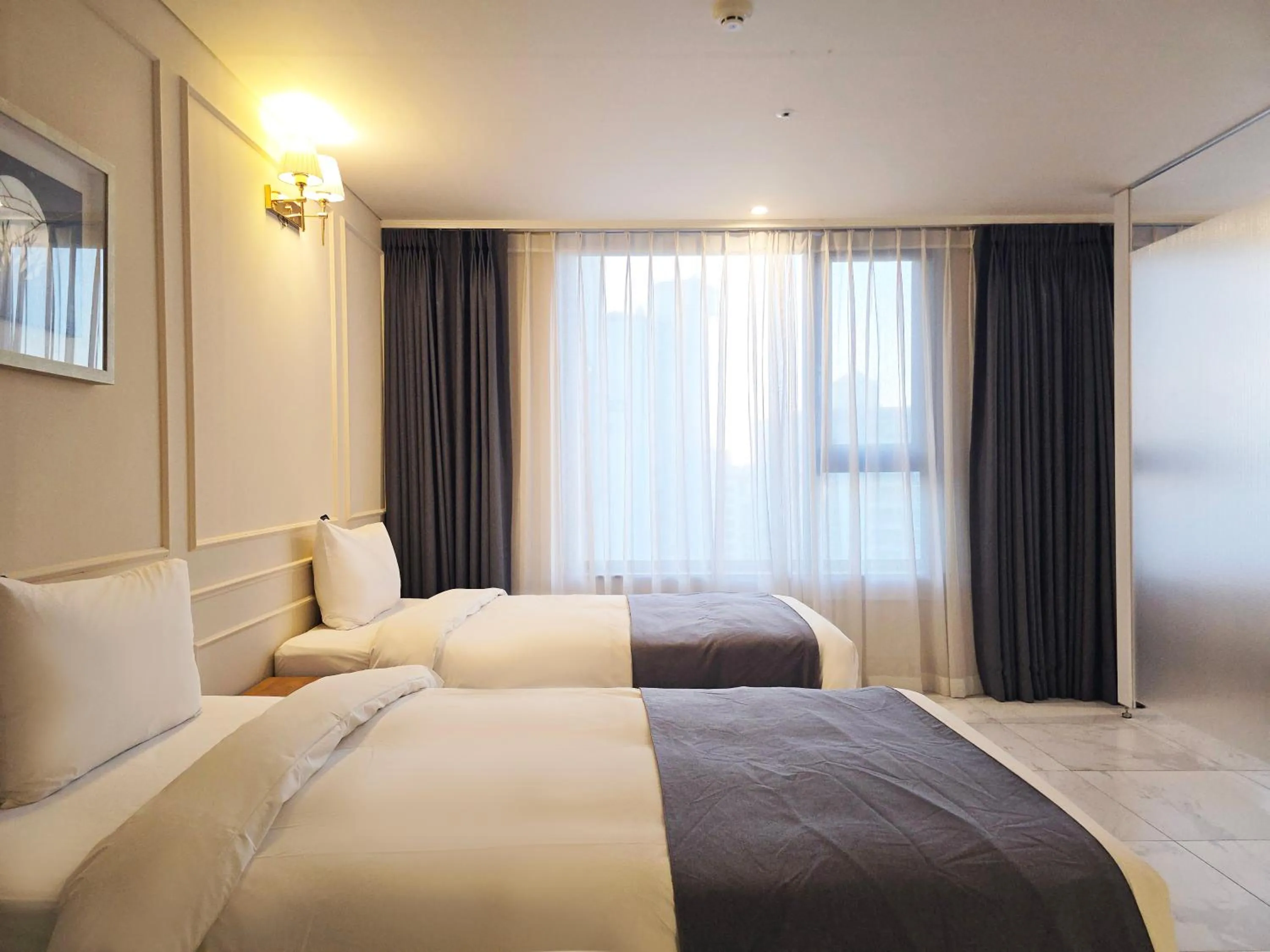 Bed in JK Blossom Hotel