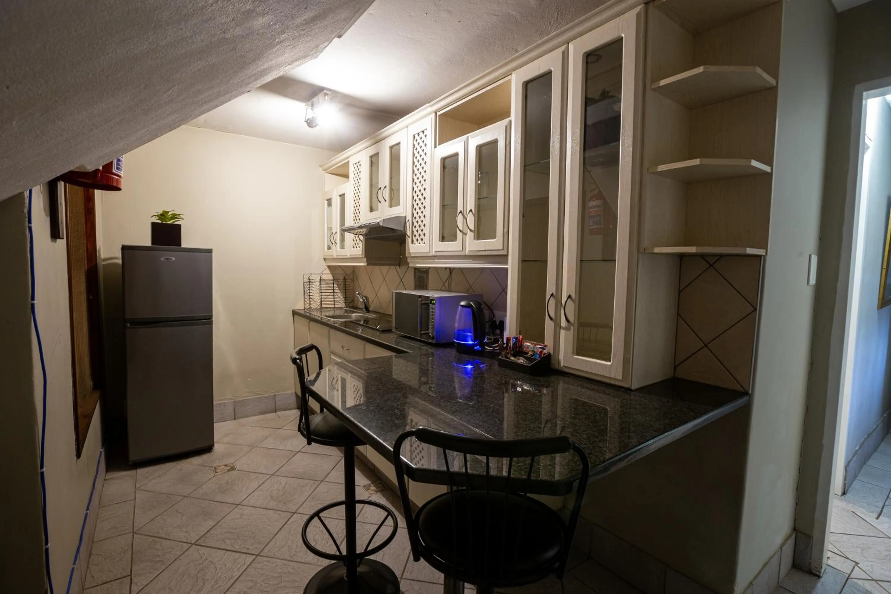 Kitchen or kitchenette in Waterfalls Boutique Hotel