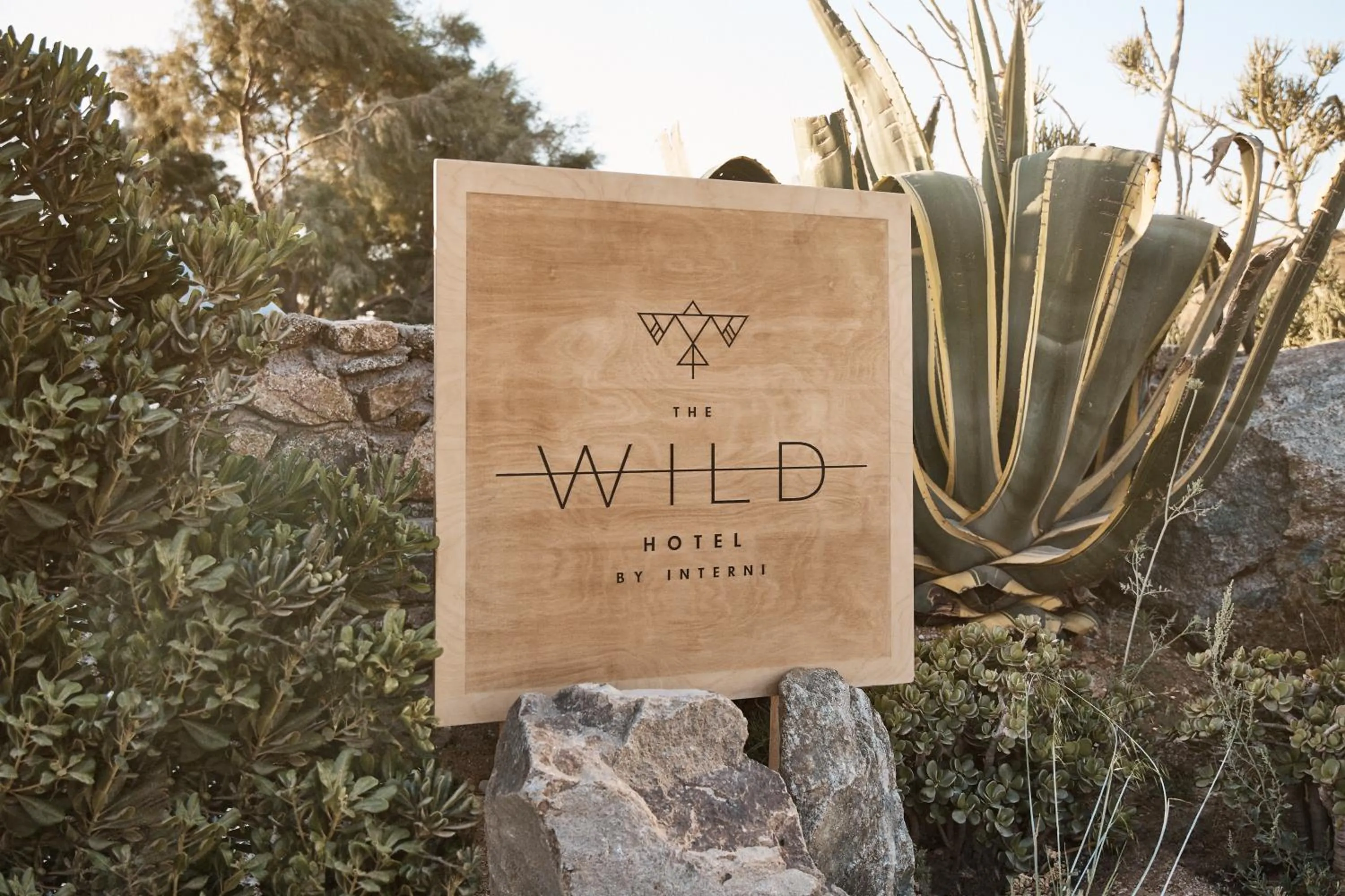 Property logo or sign in The Wild by Interni