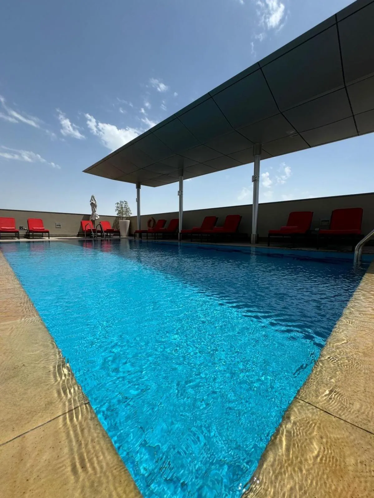 Swimming pool in Centro Al Manhal by Rotana