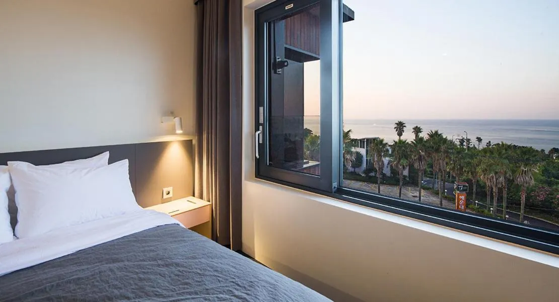 Bed in Jeju Bricks Hotel