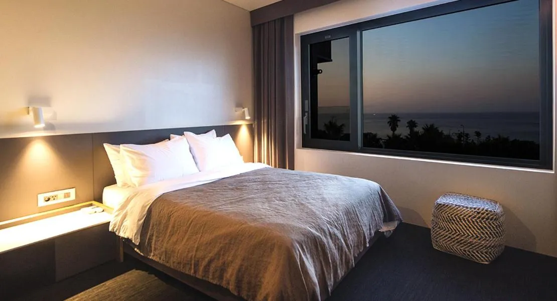 Bed in Jeju Bricks Hotel