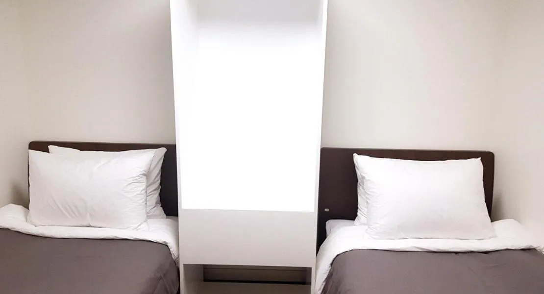 Bed in Jeju Bricks Hotel