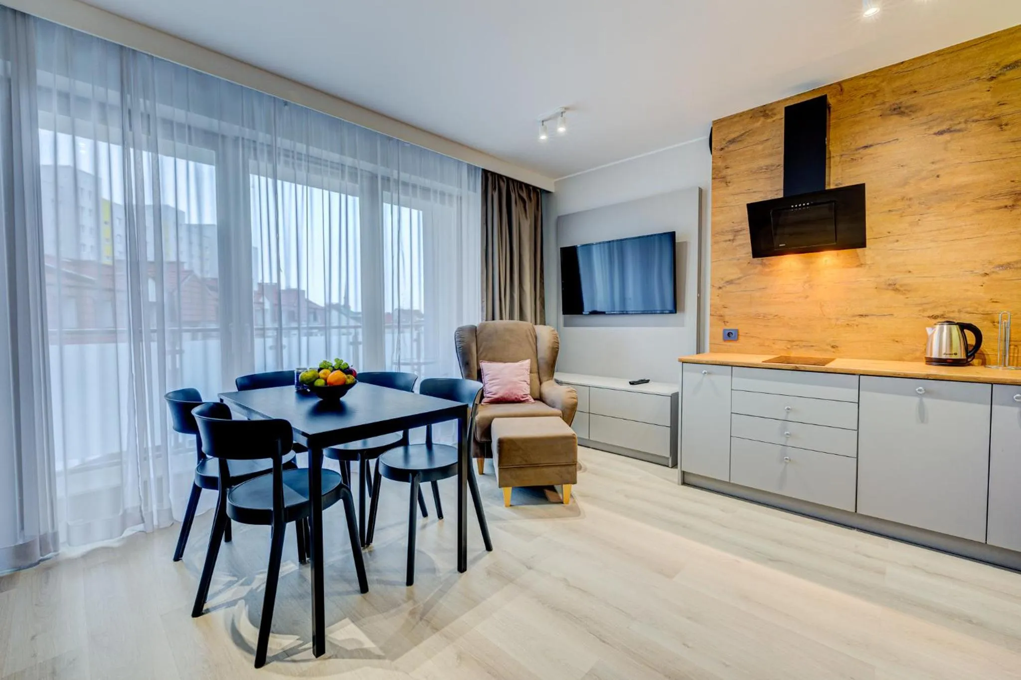 Communal lounge/ TV room in Apartamenty Rondo