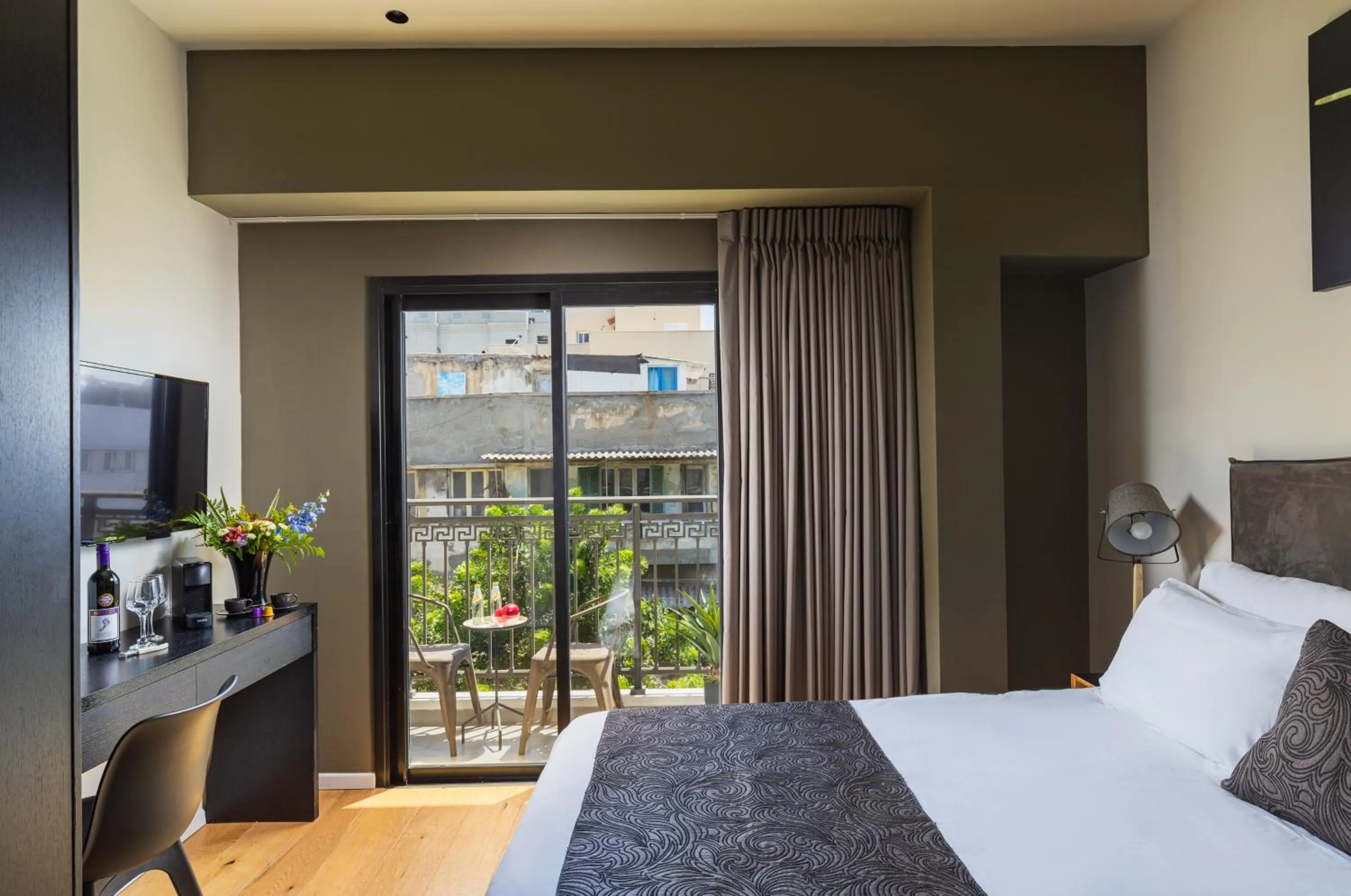Photo of the whole room, Bed in Kalvin Boutique Hotel by Levinsky Market Tel-Aviv