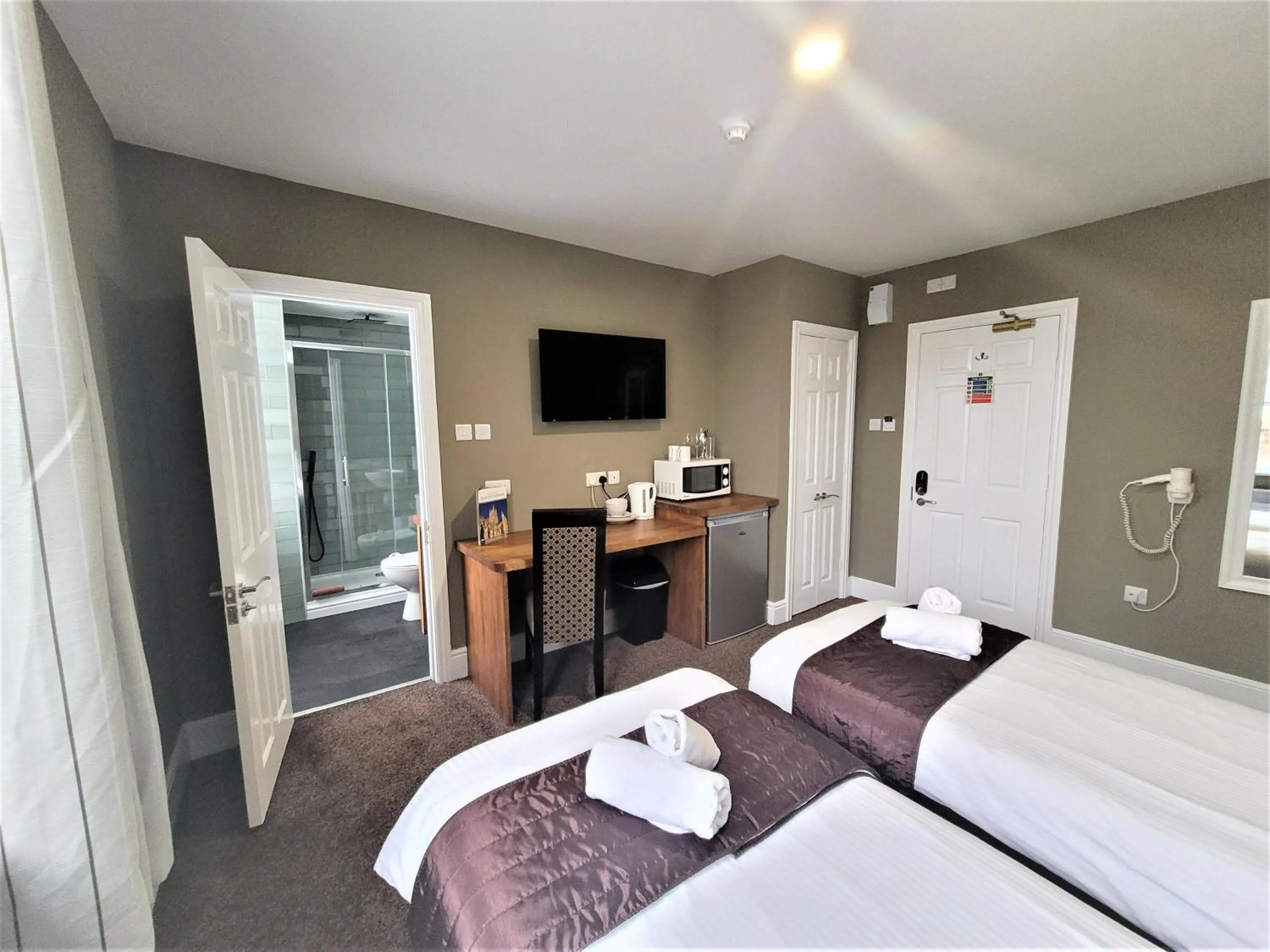 Bed in New County Hotel & Serviced Apartments by RoomsBooked