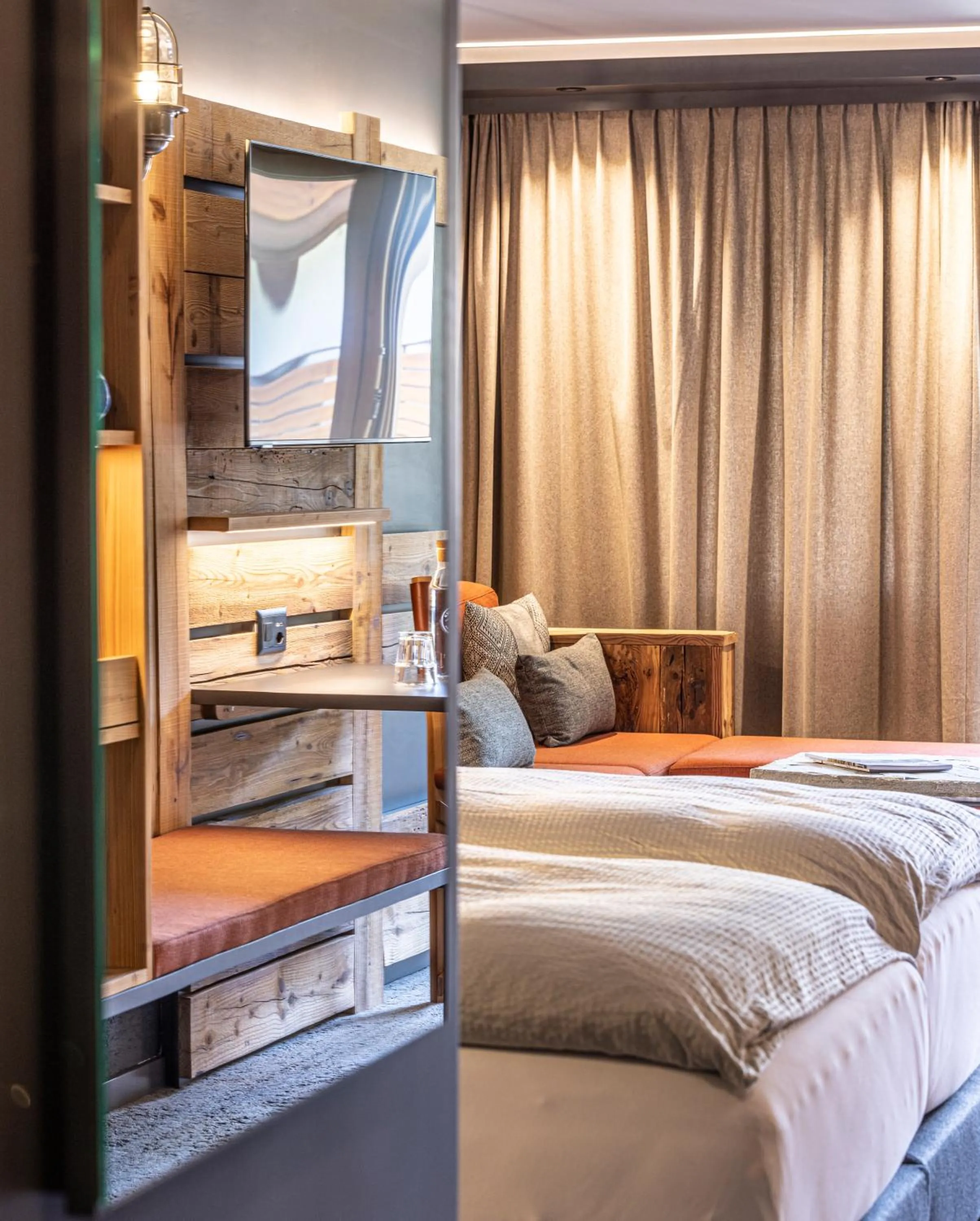 Seating area, Bed in BaseCamp Hotel