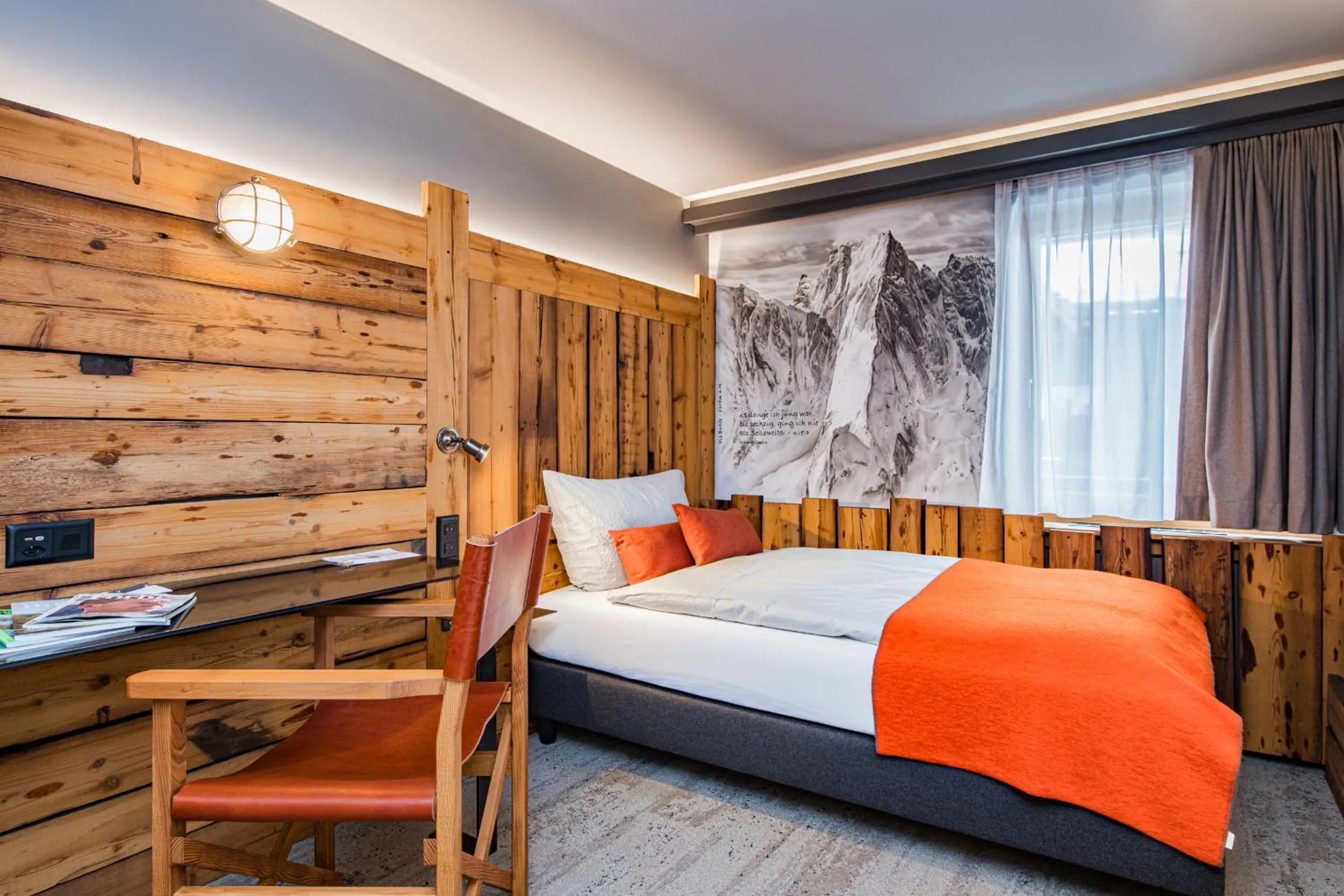 Seating area, Bed in BaseCamp Hotel