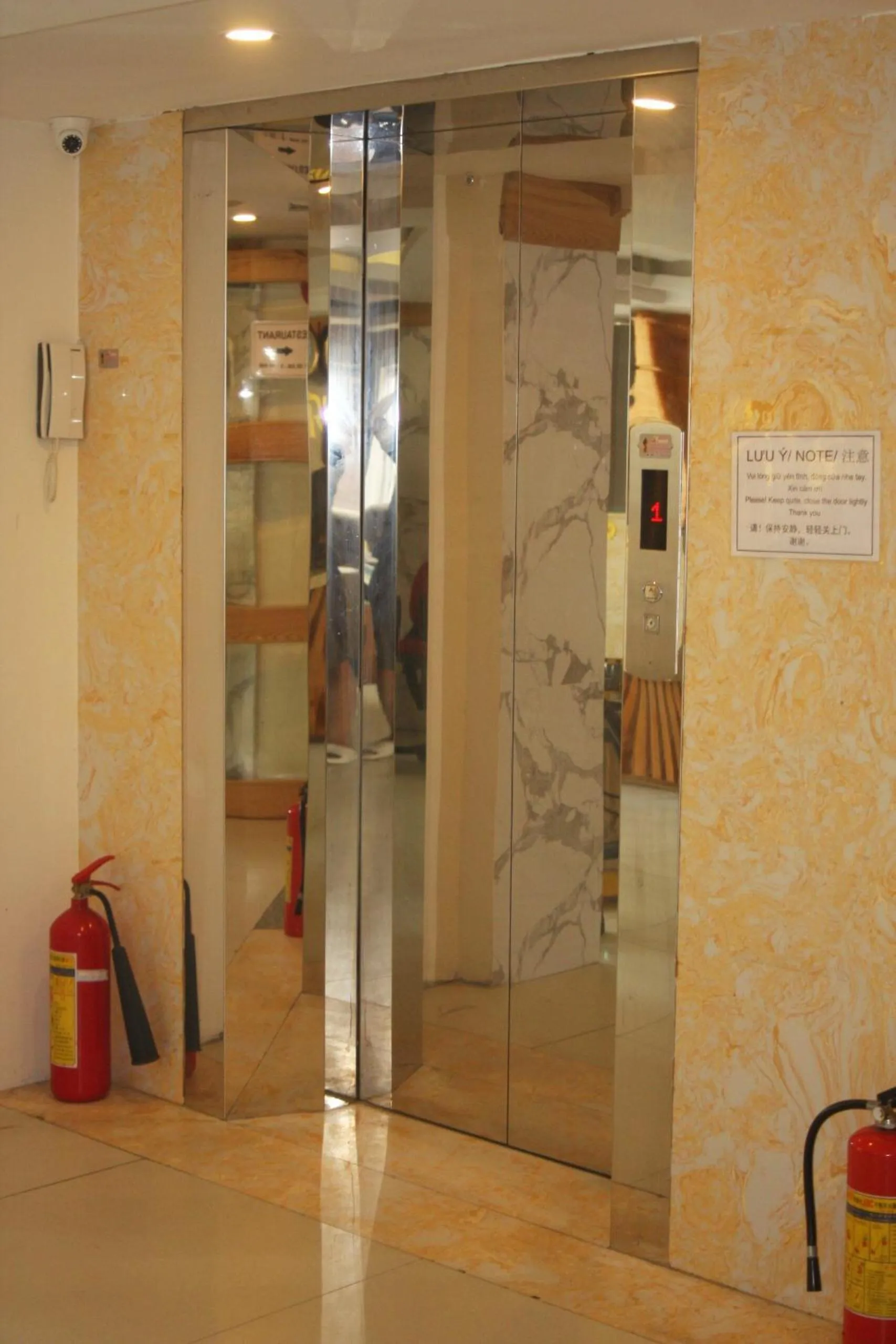 elevator in Marigold Hotel & Apartment