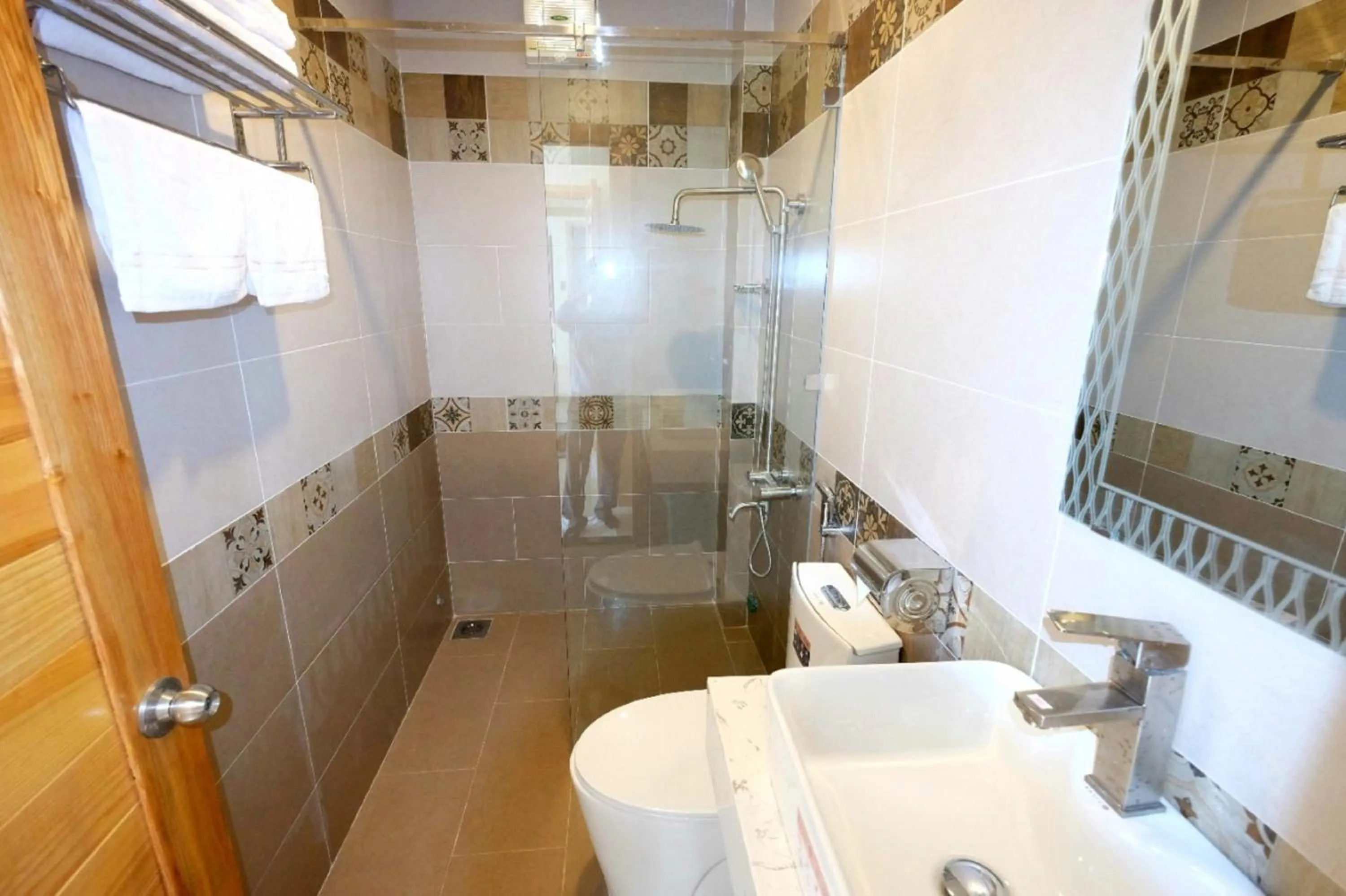 Bathroom in Marigold Hotel & Apartment