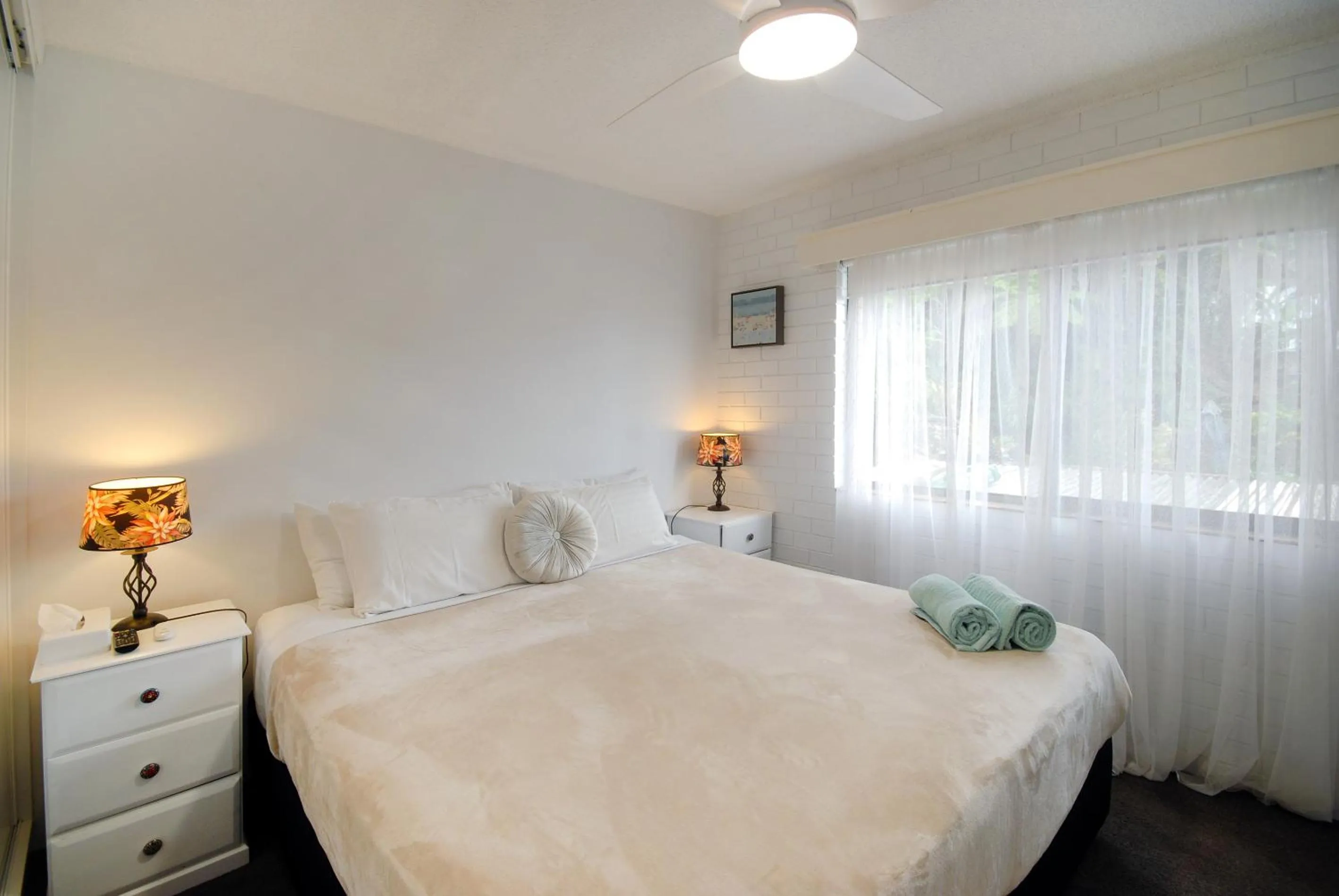 Bed in Marcel Towers Holiday Apartments