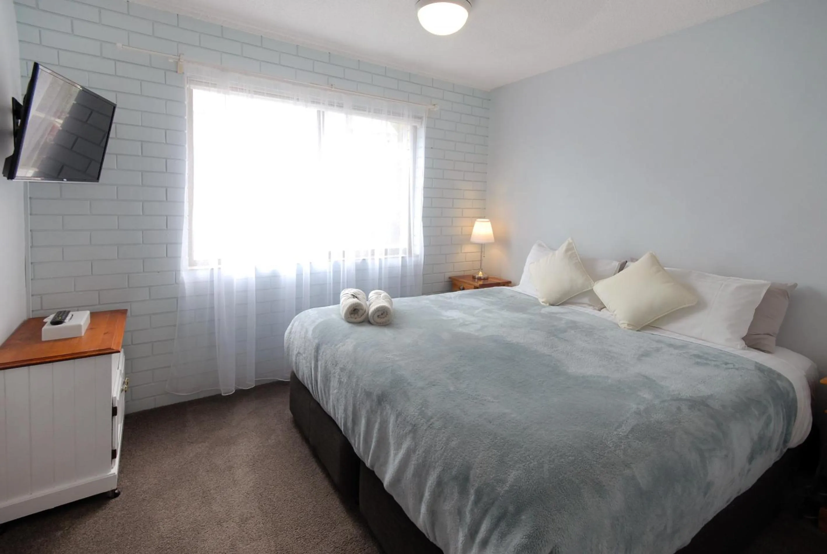 Bed in Marcel Towers Holiday Apartments