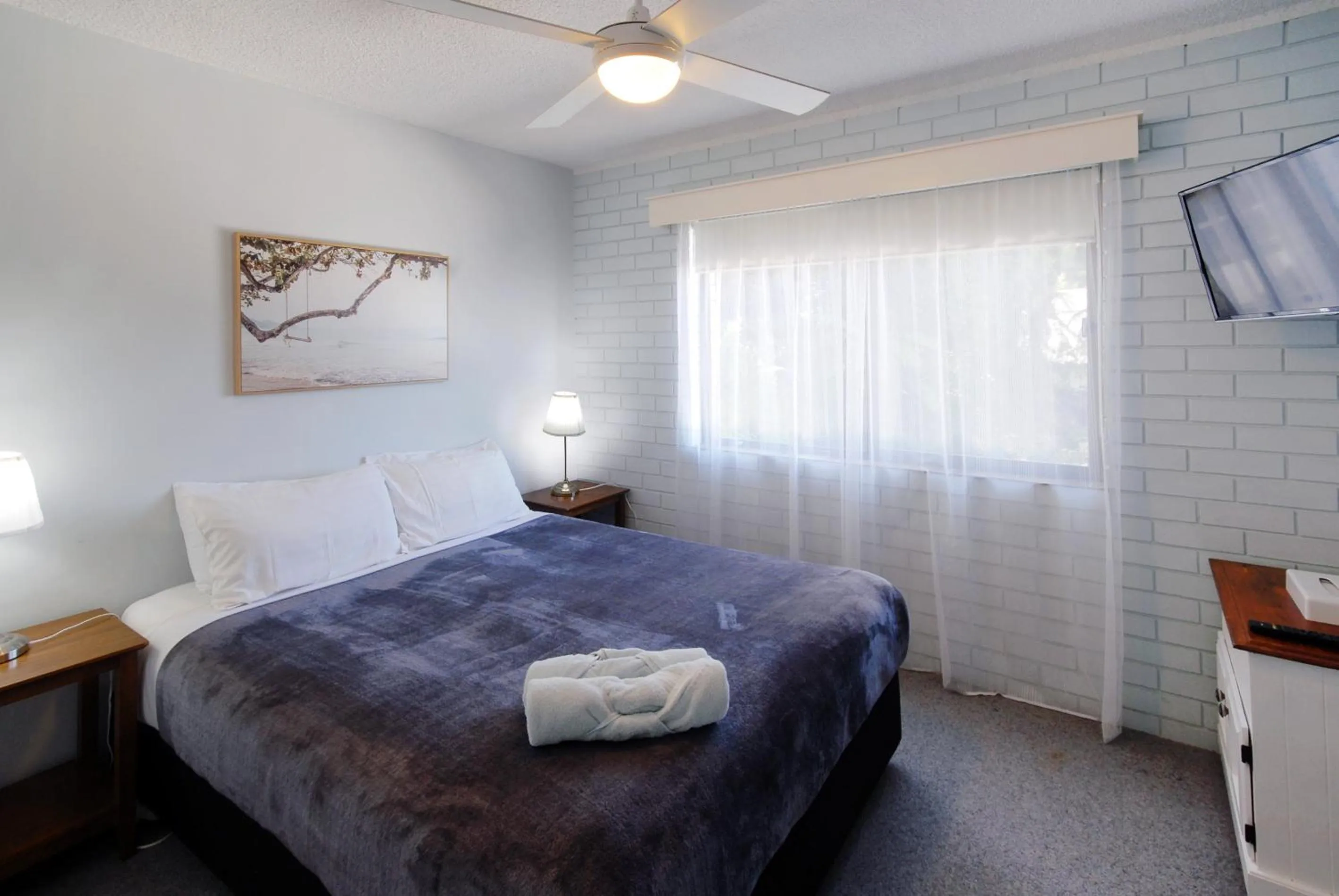 Bed in Marcel Towers Holiday Apartments