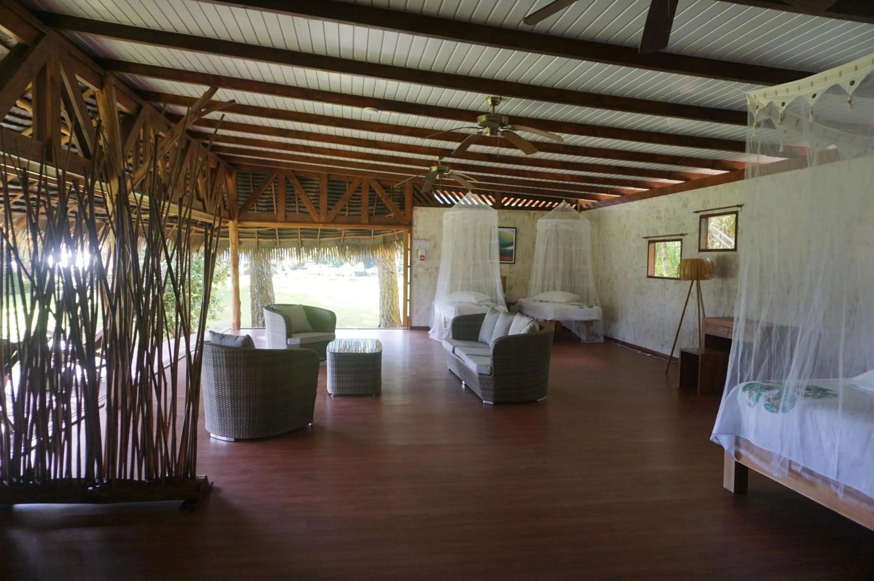 Seating area, Bed in Vanira Lodge