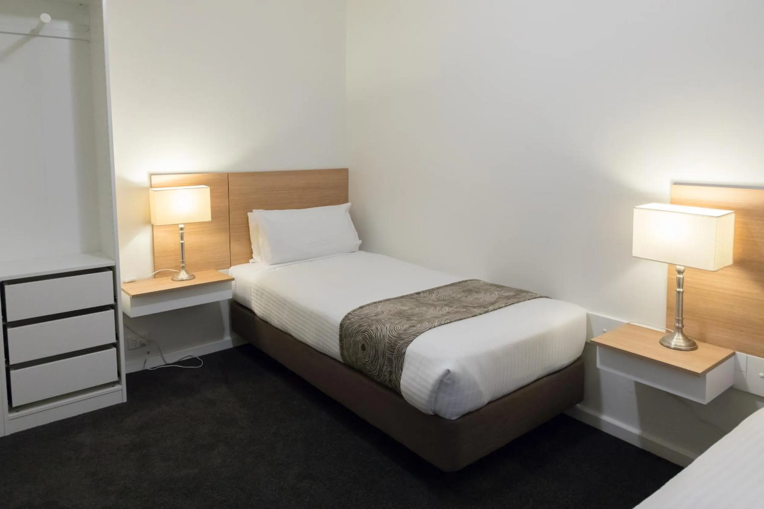 Decorative detail, Bed in Bay 10 - Suites and Apartments