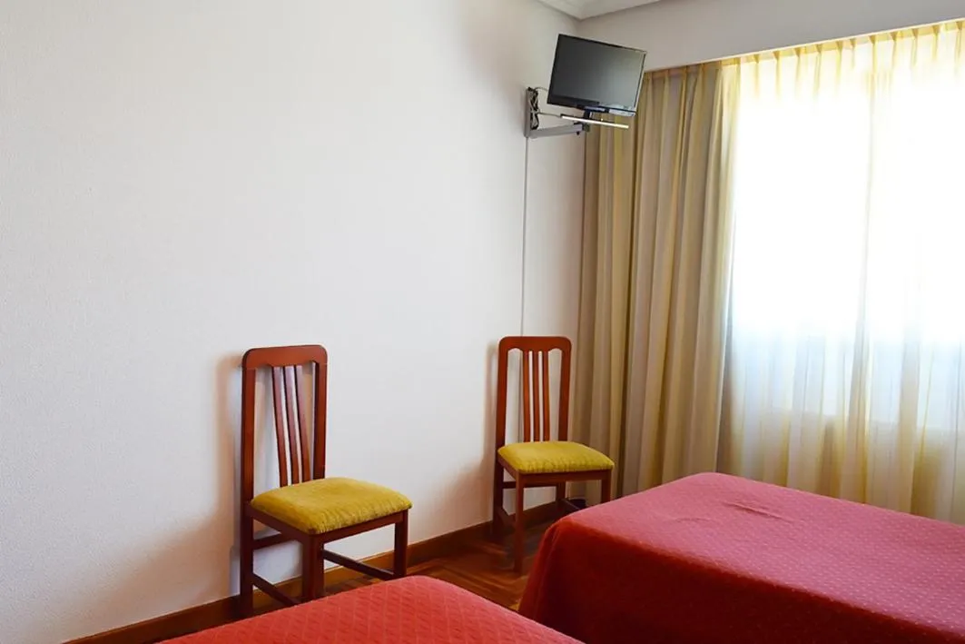 Bed in Hotel Os Caracoles