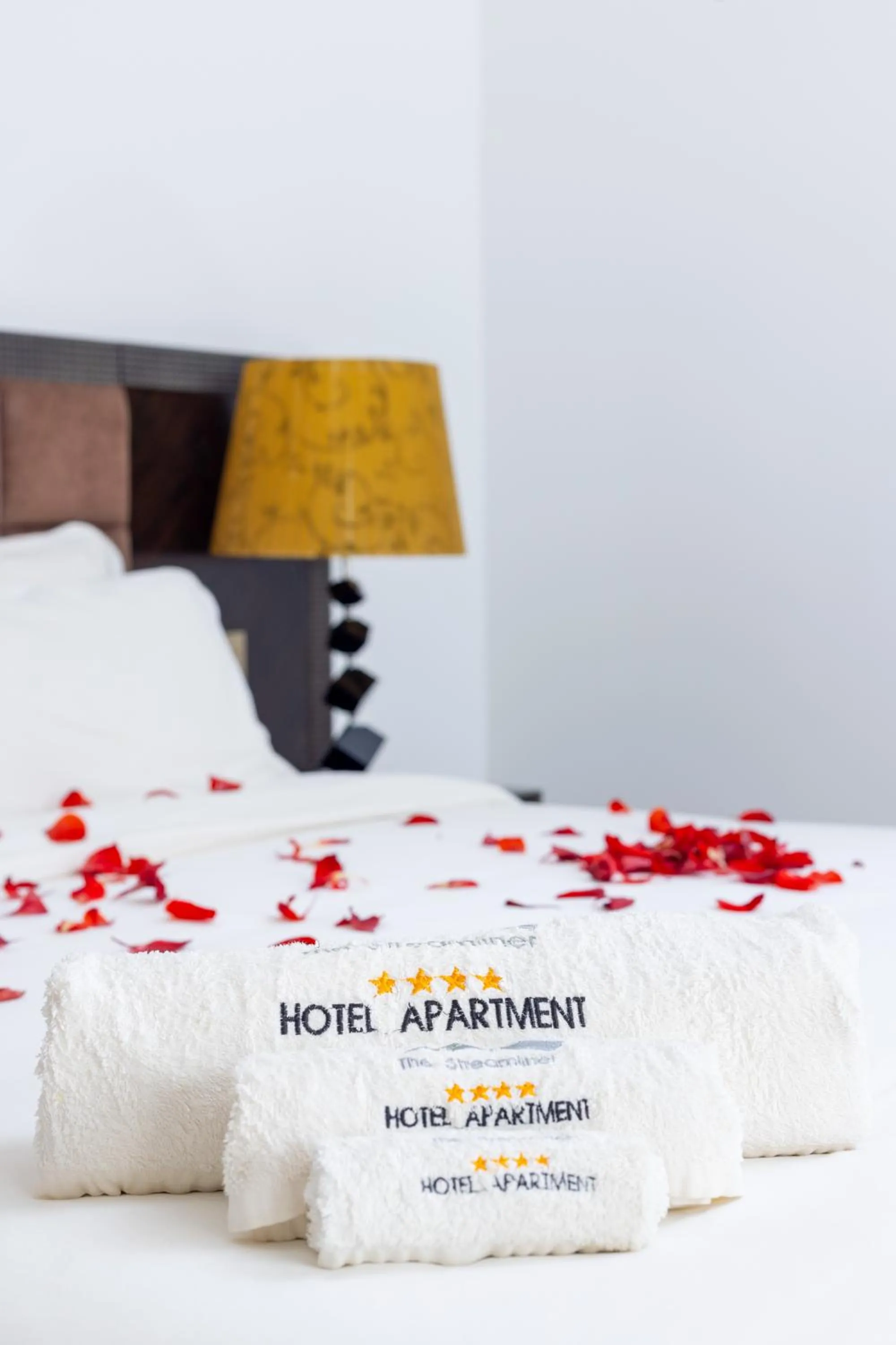 Property logo or sign, Bed in The Streamliner Hotel Apartment