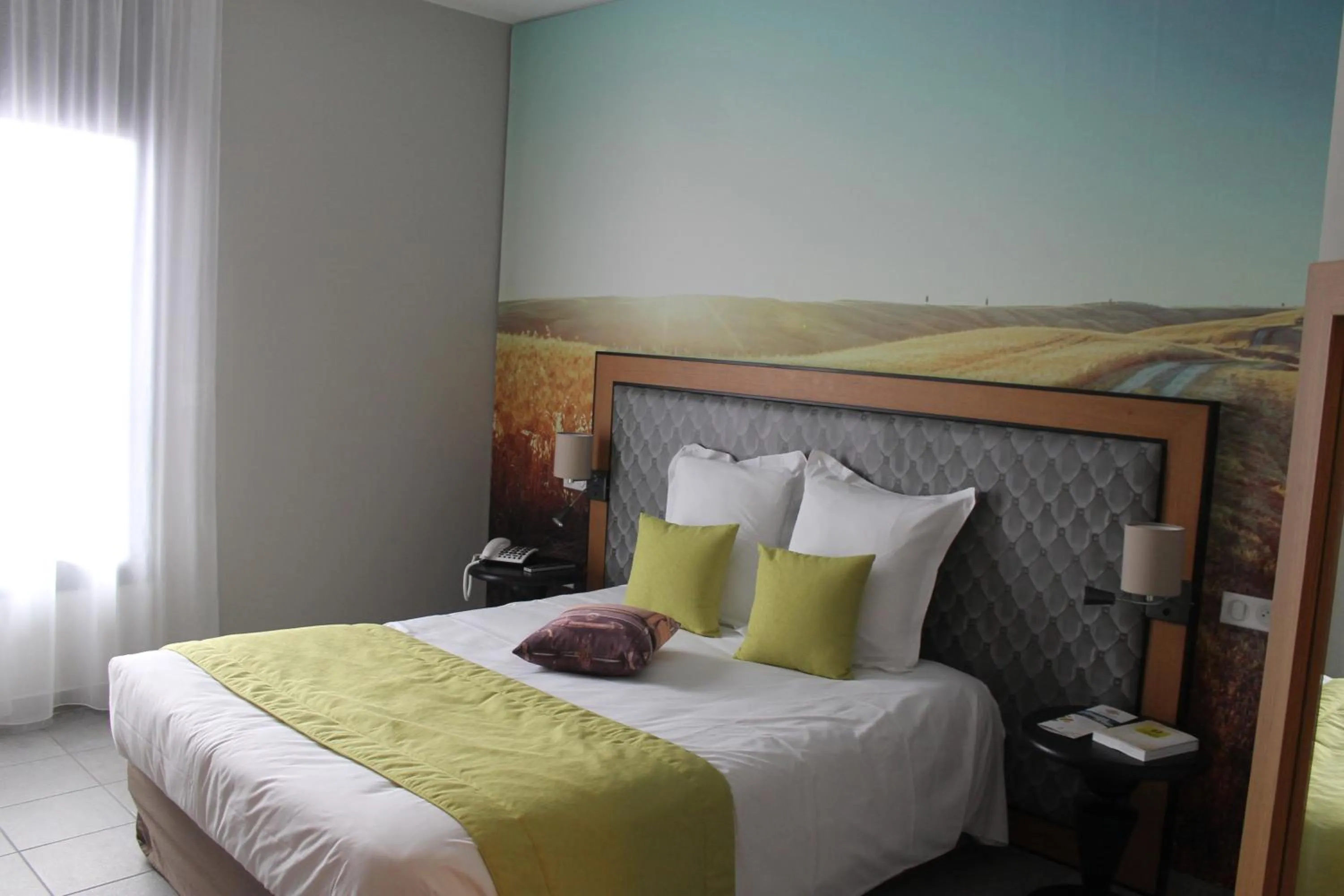 Bed in Logis Hôtel Le Tisseur des Saveurs