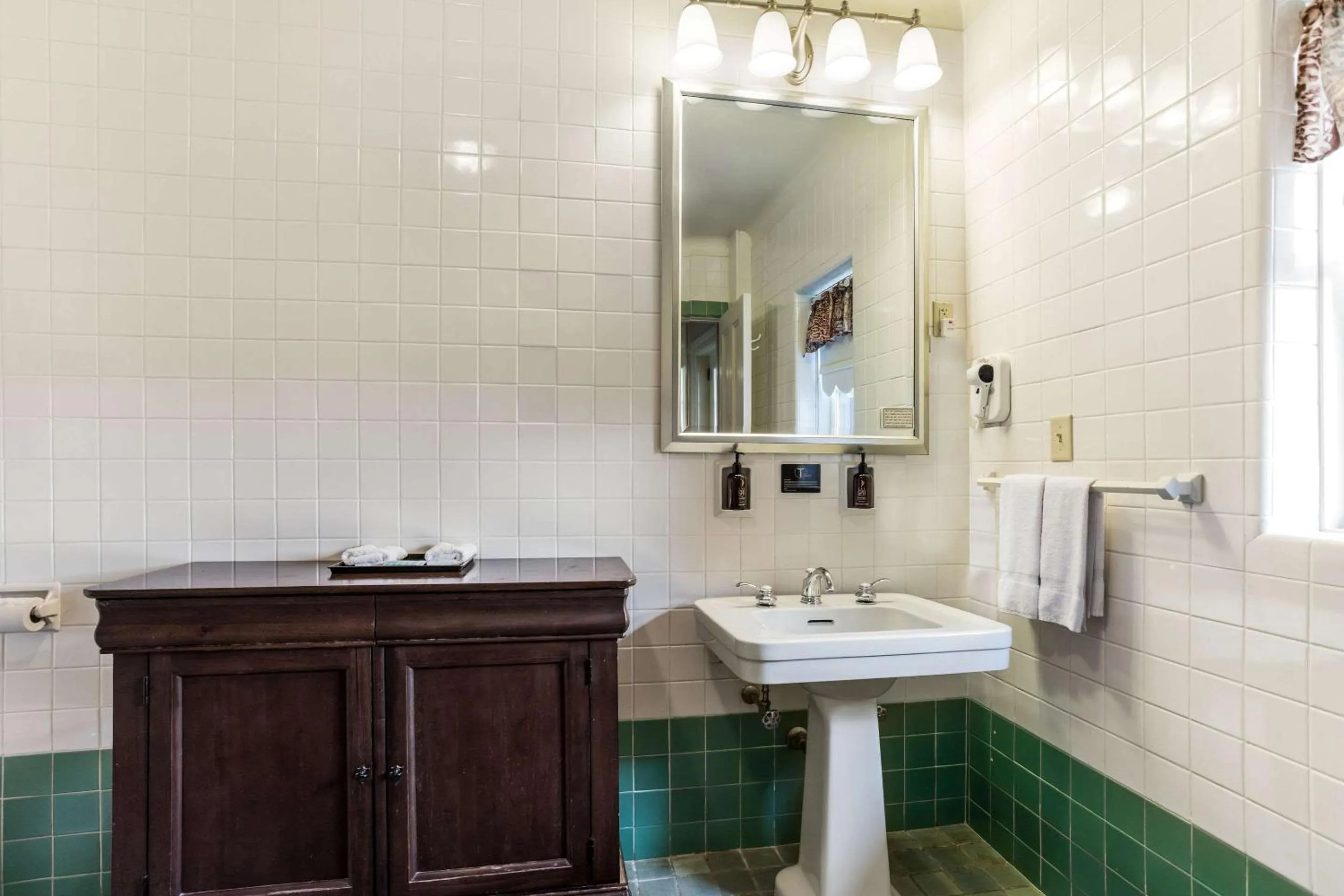 Bathroom in Traditions Hotel & Spa Johnson City - Binghamton, an Ascend Collection Hotel