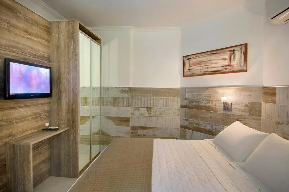 Bed in Pousada Bora Bora