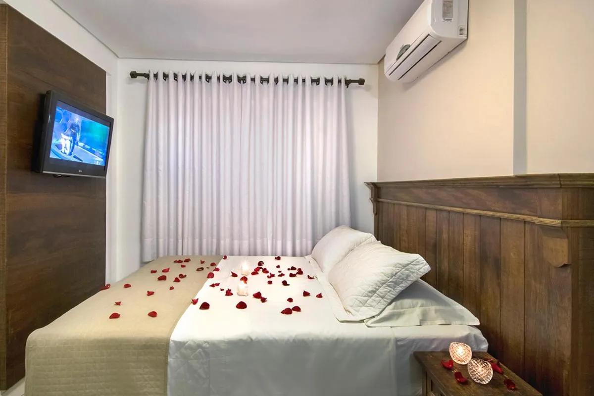 Bed in Pousada Bora Bora