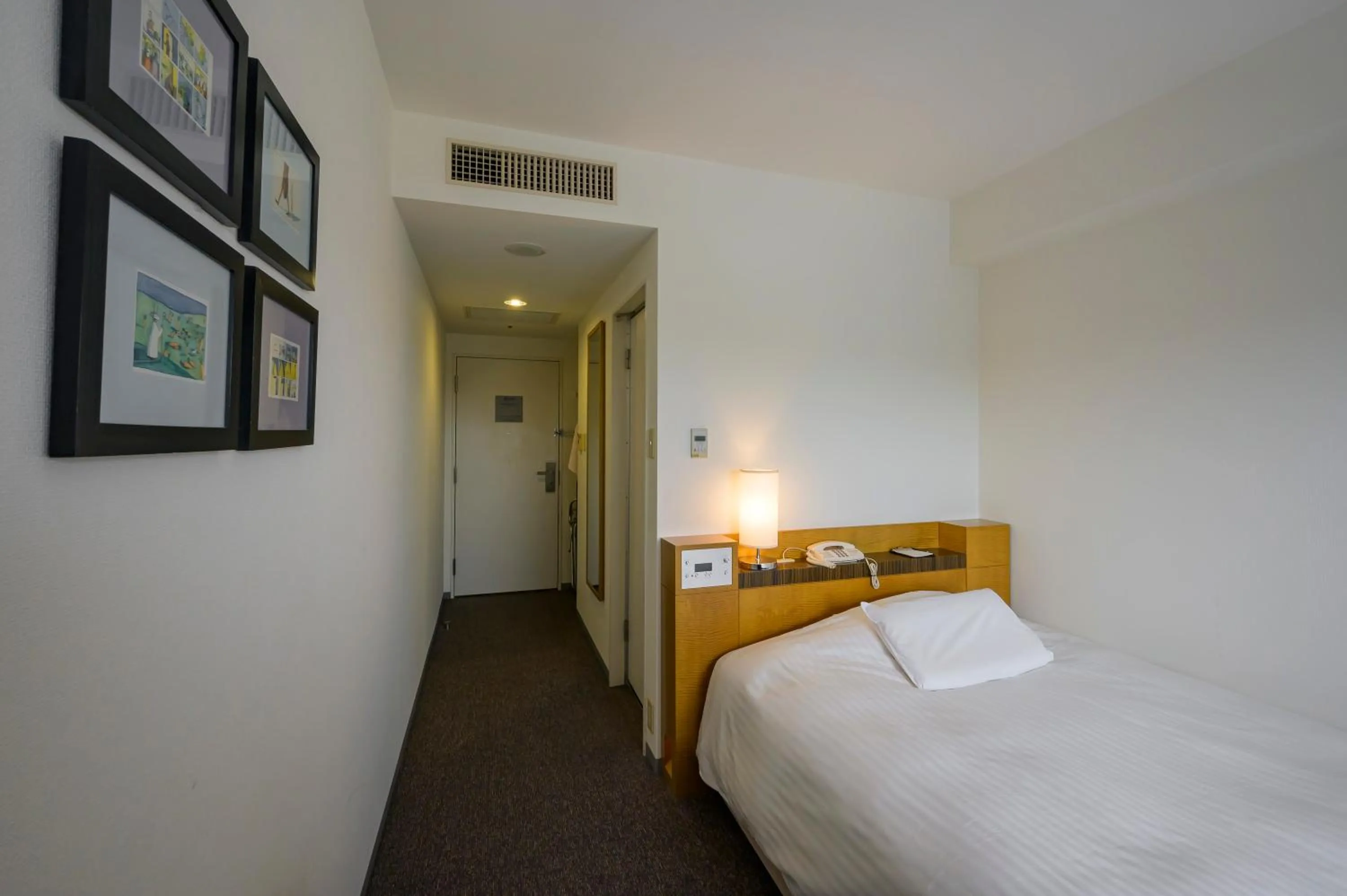 Bed in Twin Leaves Hotel Izumo