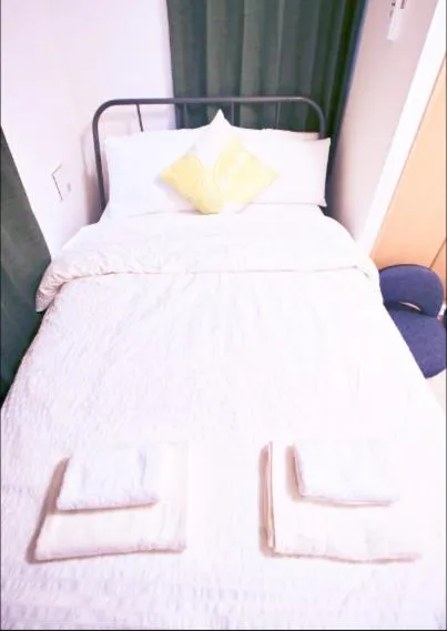 Bed in Uhome Kanda Hotel