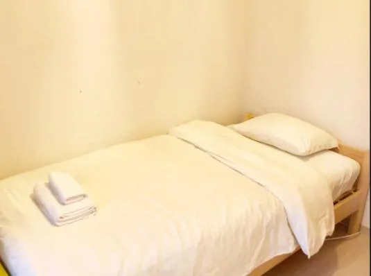 Bed in Uhome Kanda Hotel