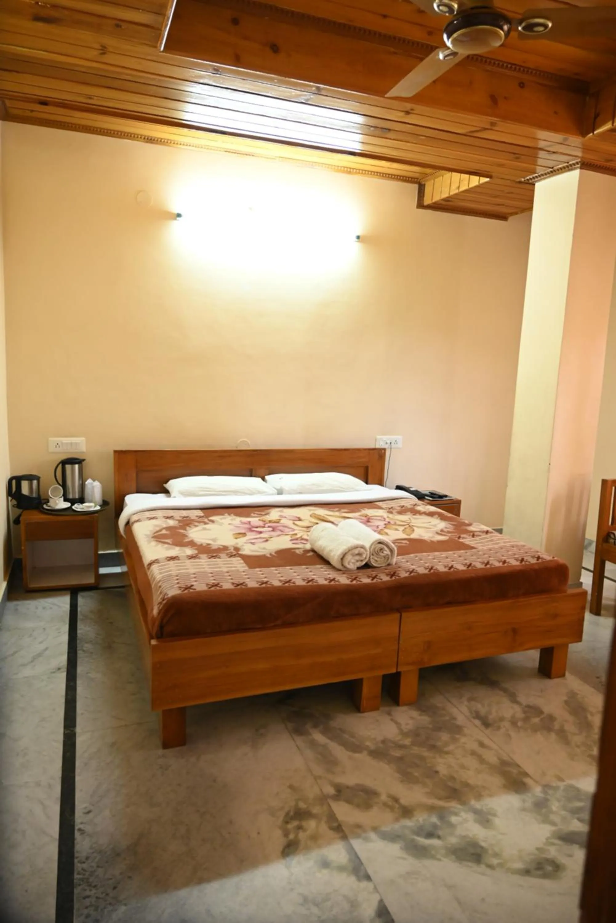 Bed in Hotel Atul Regency