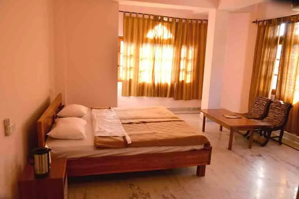 Bed in Hotel Atul Regency