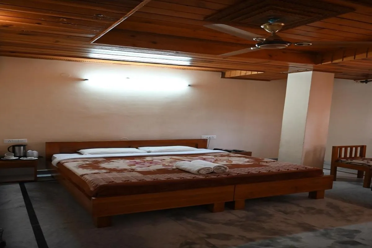 Bed in Hotel Atul Regency