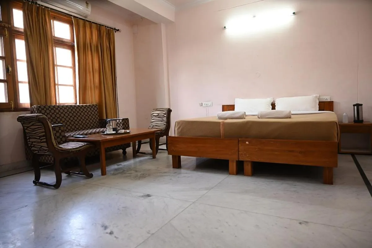 Bed in Hotel Atul Regency