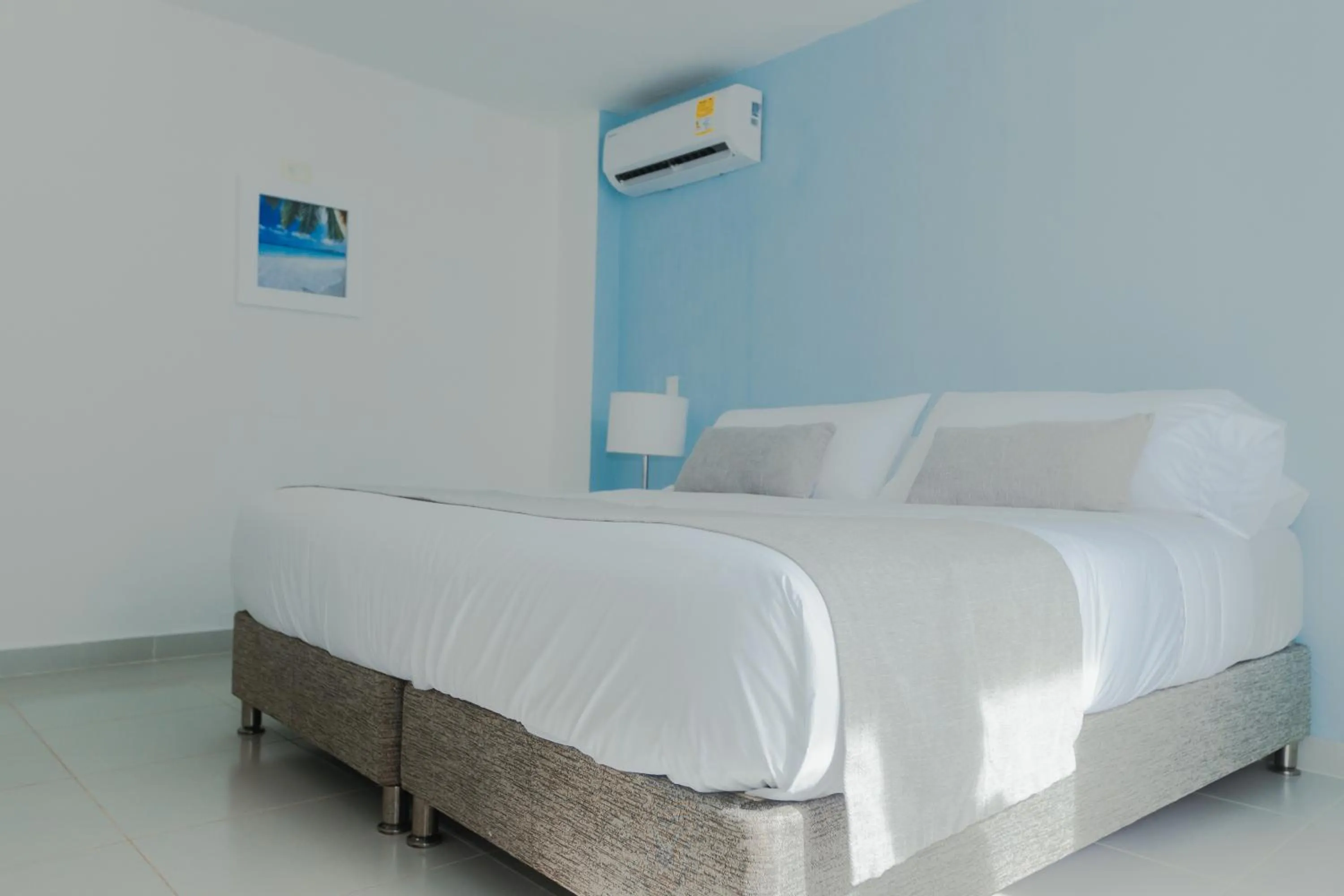 Bed in Hotel San Luis Beach House By OxoHotel