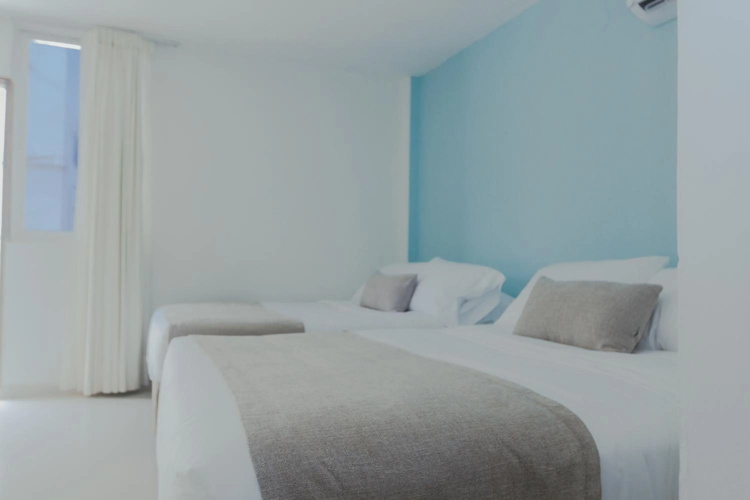 Bed in Hotel San Luis Beach House By OxoHotel