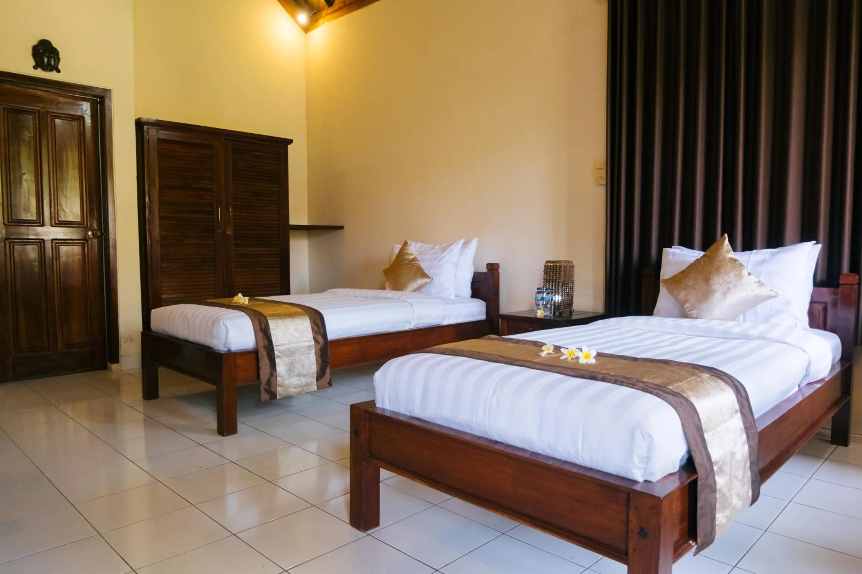 Bed in New Starlight Hotel Lovina