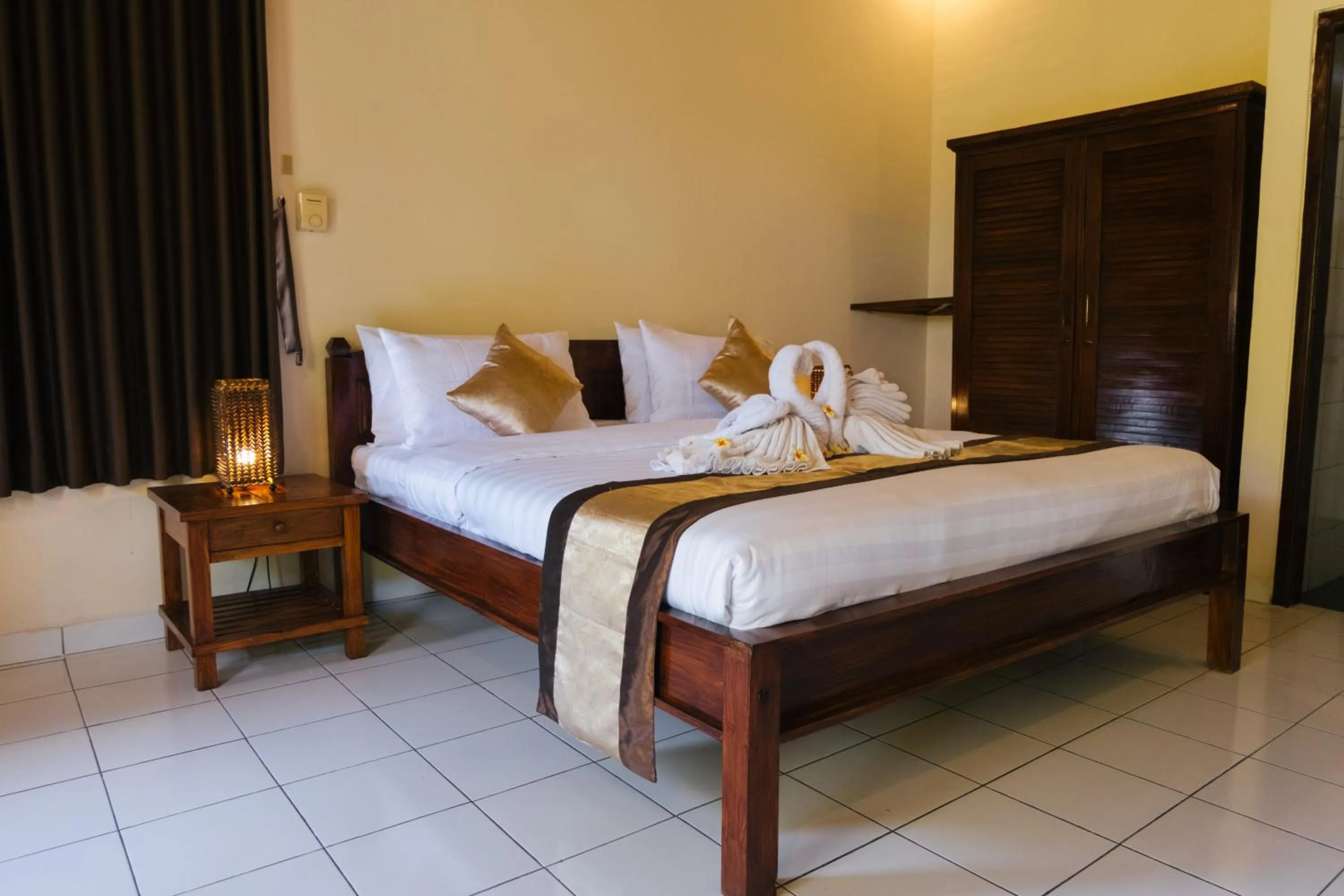 Bed in New Starlight Hotel Lovina