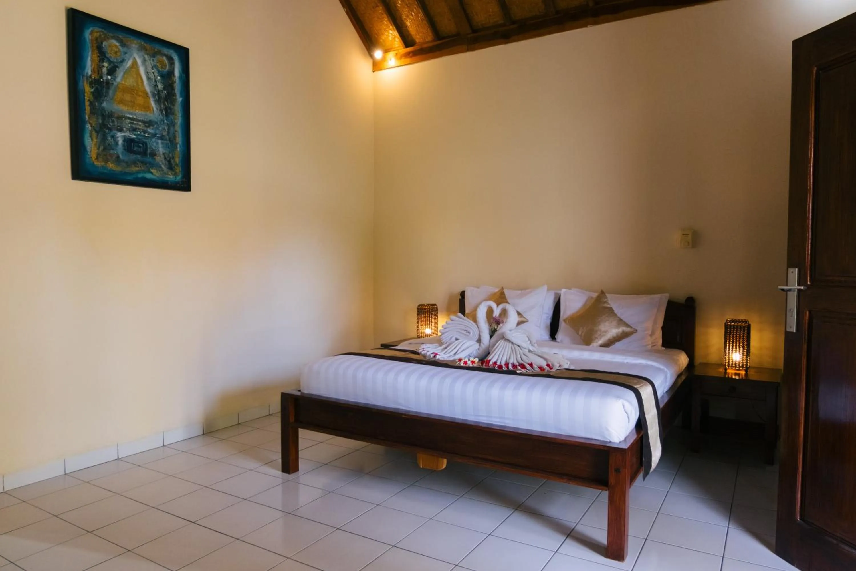 Bed in New Starlight Hotel Lovina