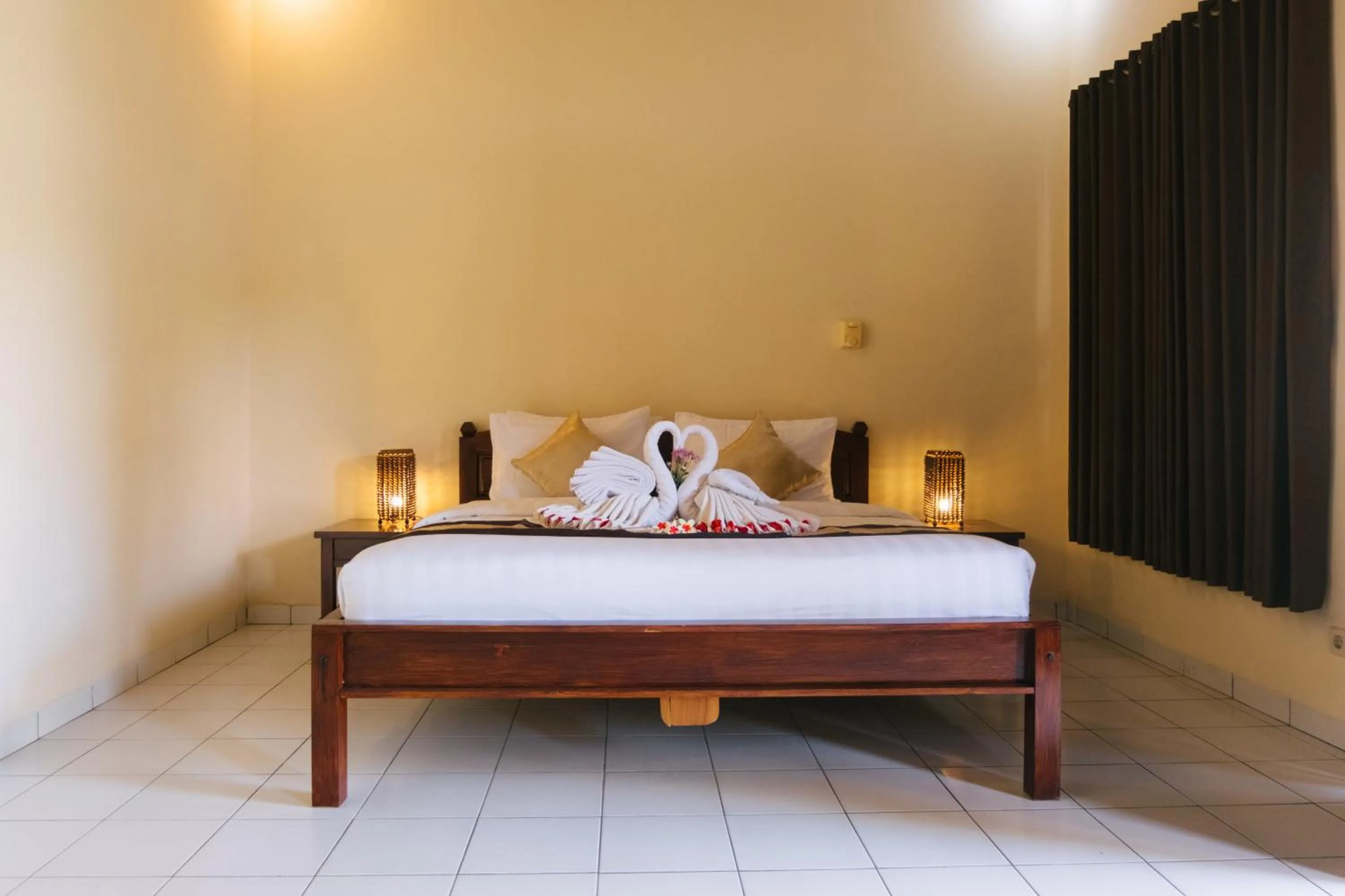 Bed in New Starlight Hotel Lovina