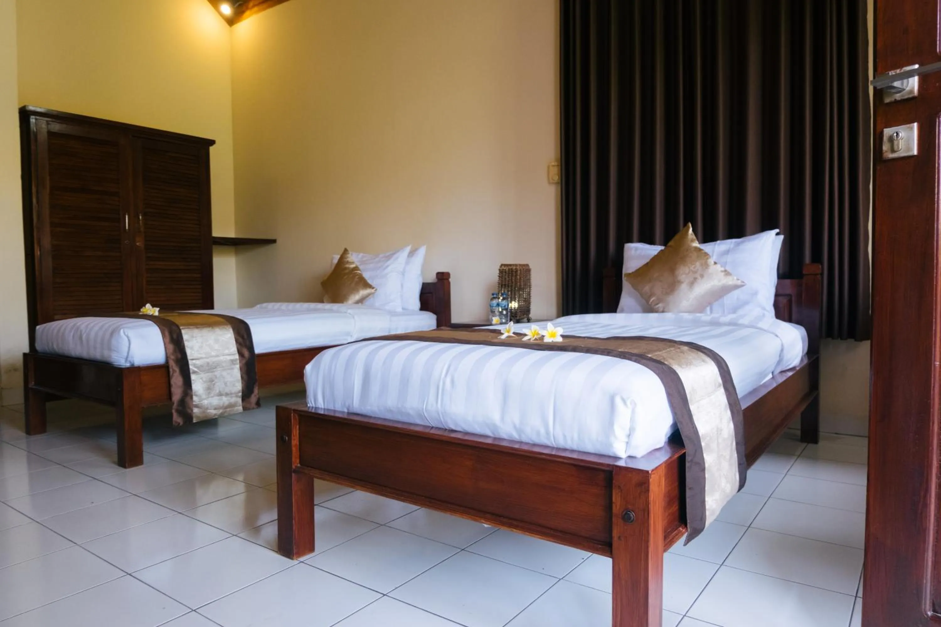 Bed in New Starlight Hotel Lovina