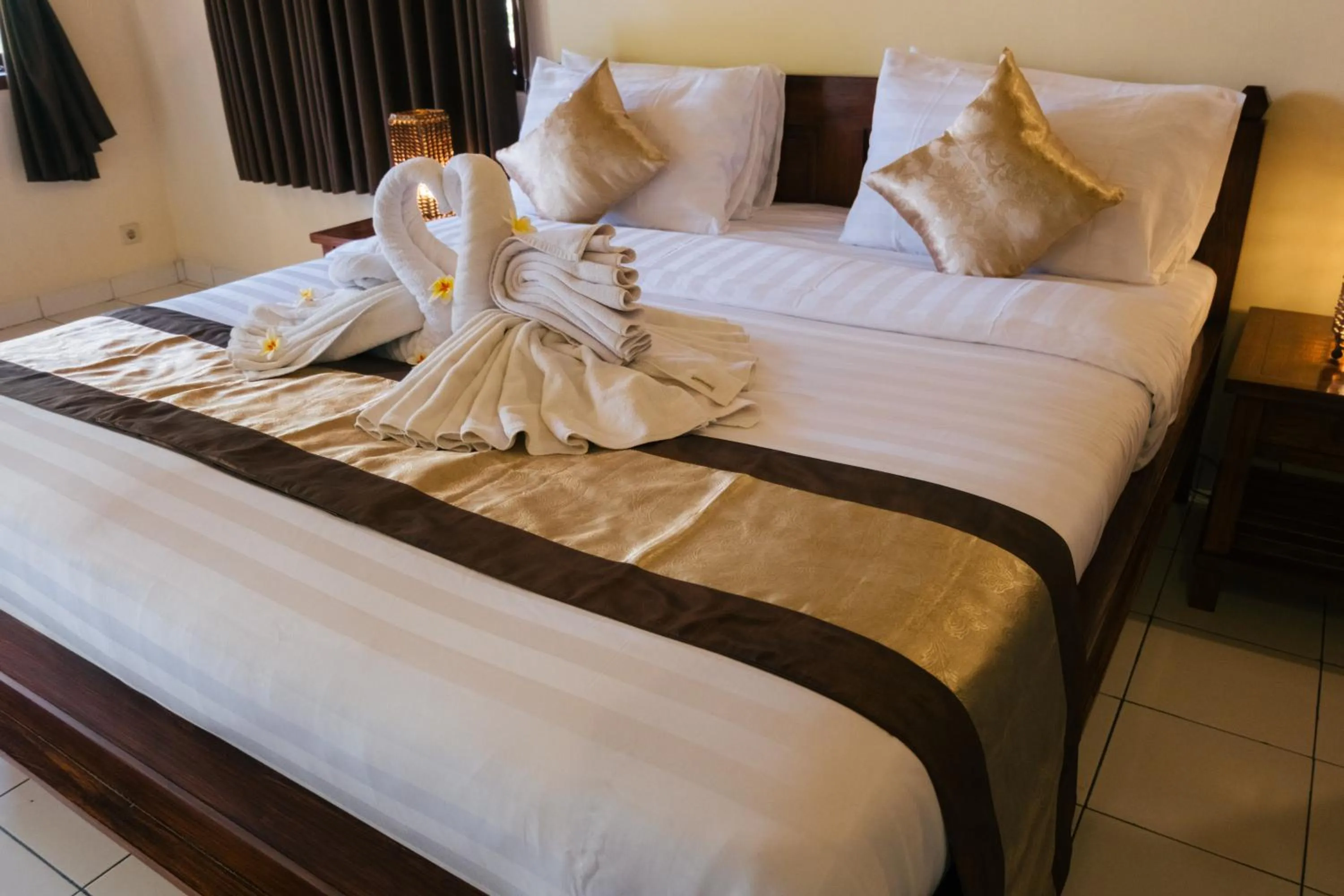 Bed in New Starlight Hotel Lovina