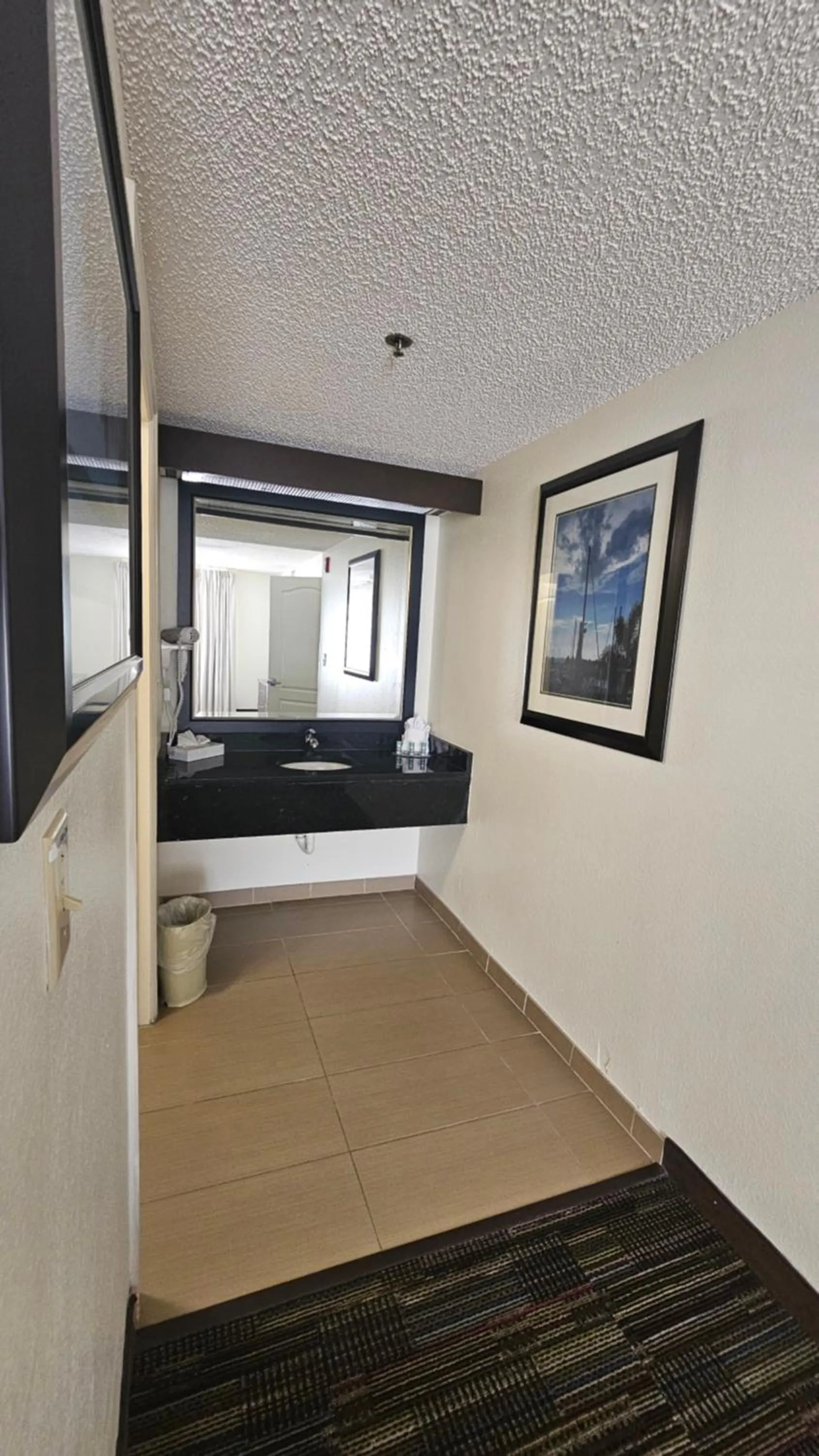 Bathroom in SureStay Plus by Best Western Orlando Lake Buena Vista