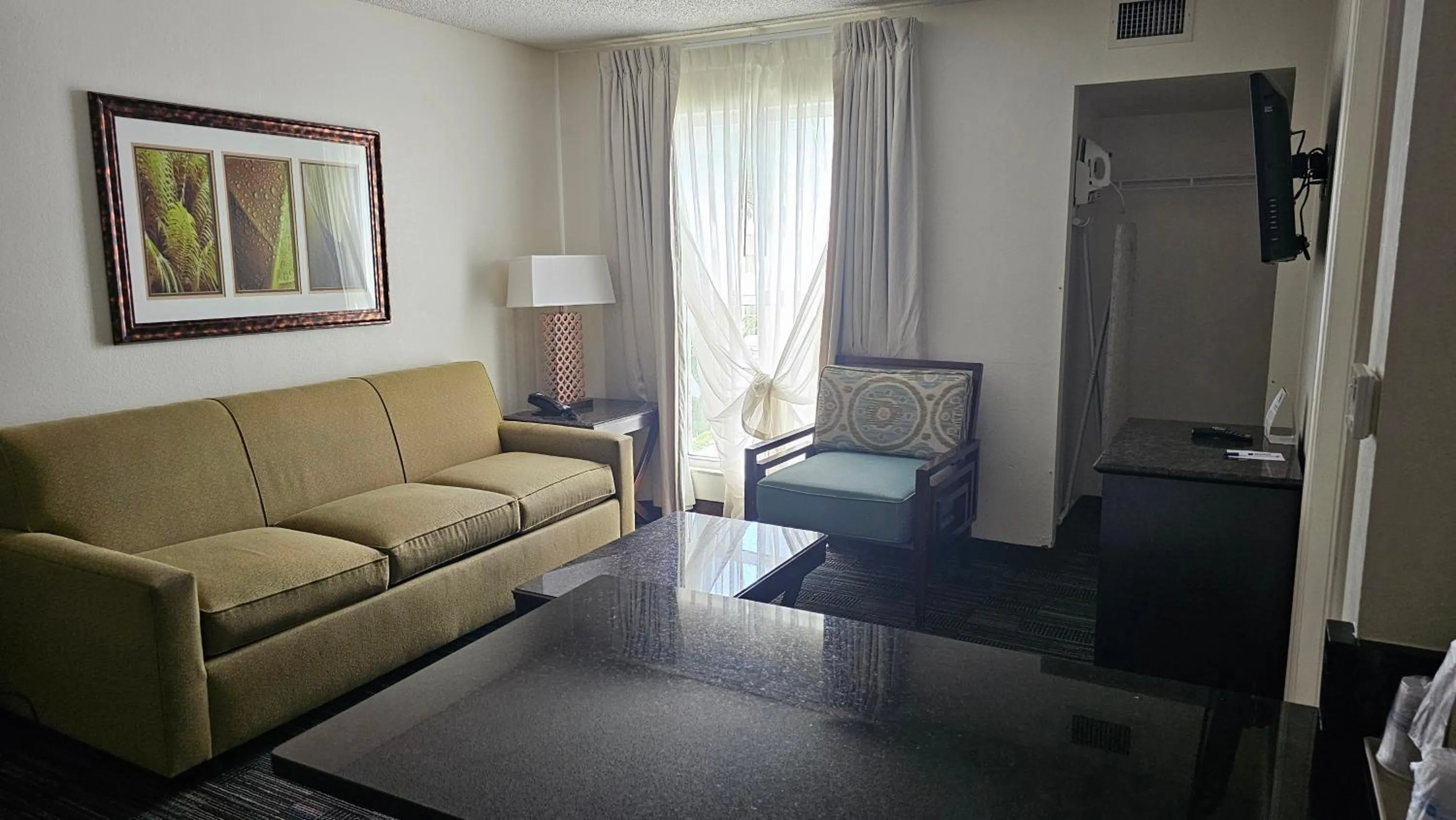 Living room in SureStay Plus by Best Western Orlando Lake Buena Vista
